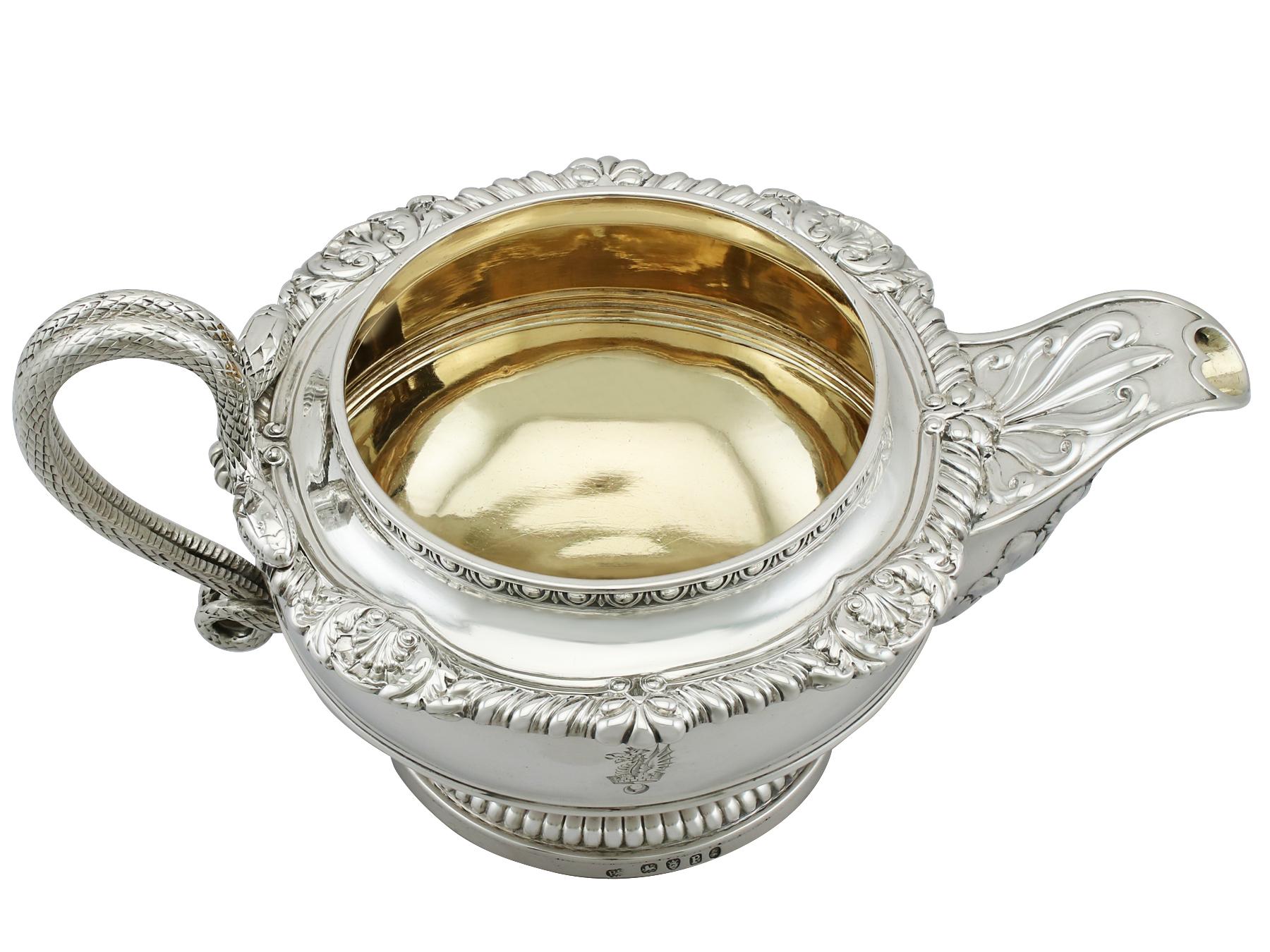 An magnificent, fine and impressive, antique George III English sterling silver cream jug made by Paul Storr; an addition to our Georgian silver teaware collection.

This magnificent antique Georgian sterling silver cream jug has a circular rounded