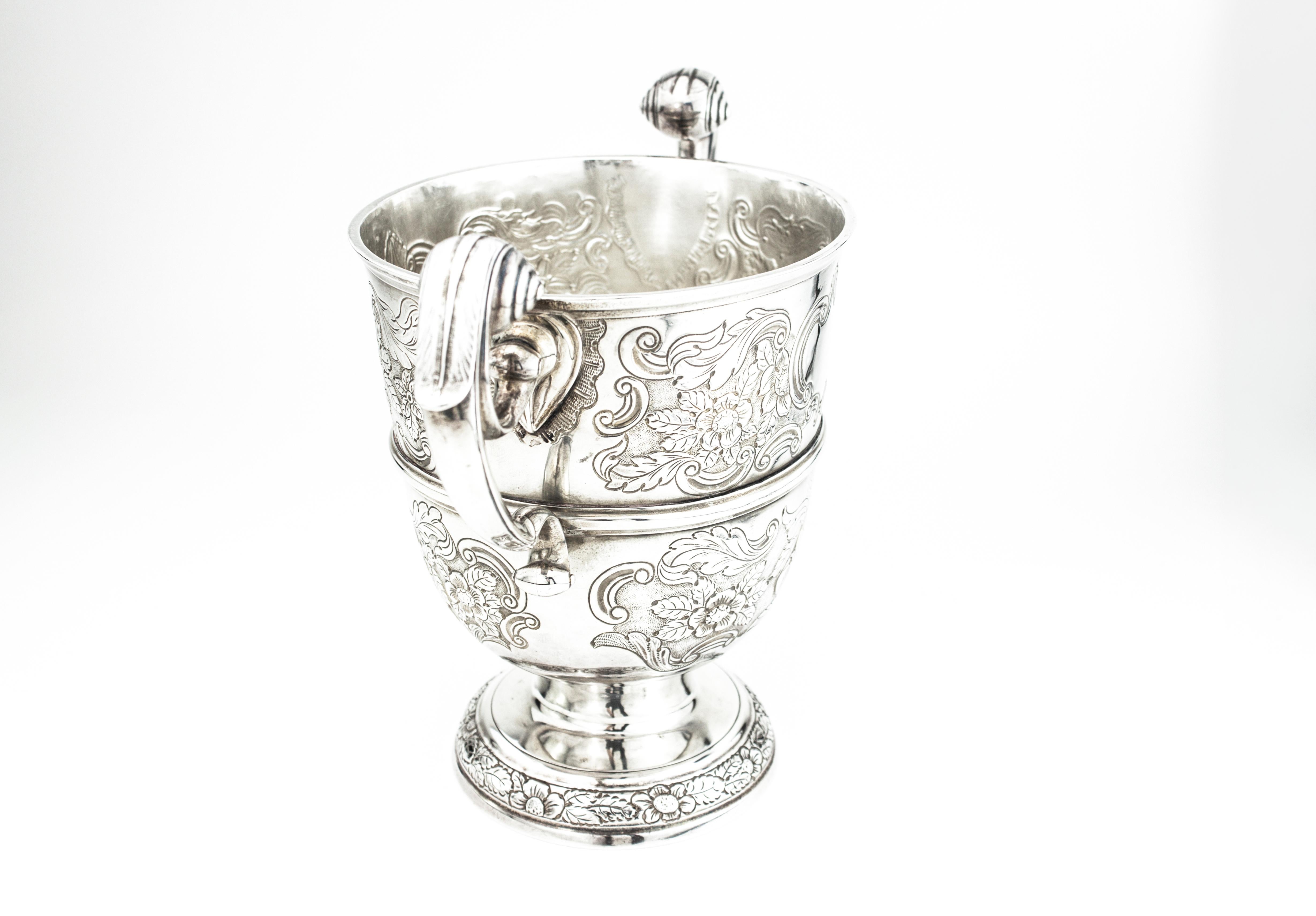 Antique George III sterling silver Irish cup
Maker: I E, Unidentified
Made in Ireland, Dublin, 1769
Fully hallmarked.

Dimensions -
Length 26.5 cm
Width 14.5 cm
Height 20 cm
Weight: 930 grams

Condition: Minor wear from general usage, no