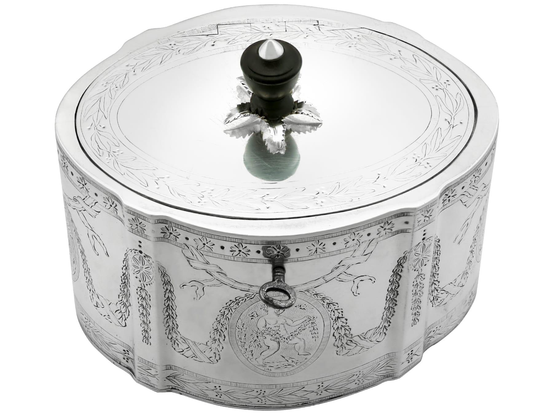 An exceptional, fine and impressive antique Georgian English sterling silver locking tea caddy; an addition to our silver teaware collection.

This exceptional antique George III sterling silver tea caddy has an oval-shaped form.

The surface of