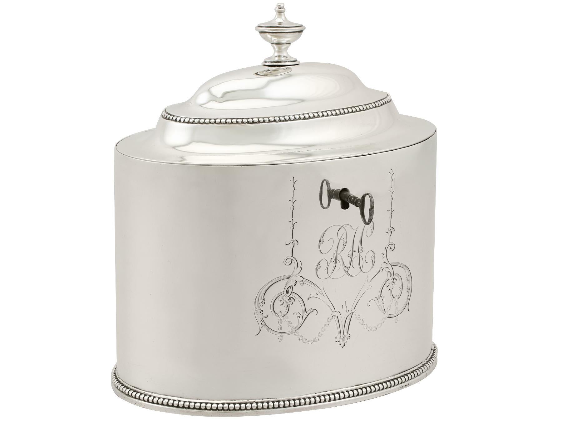 An exceptional, fine and impressive antique Georgian English sterling silver locking tea caddy made by Hester Bateman; an addition to our silver teaware collection.

This exceptional antique George III sterling silver locking tea caddy has an oval