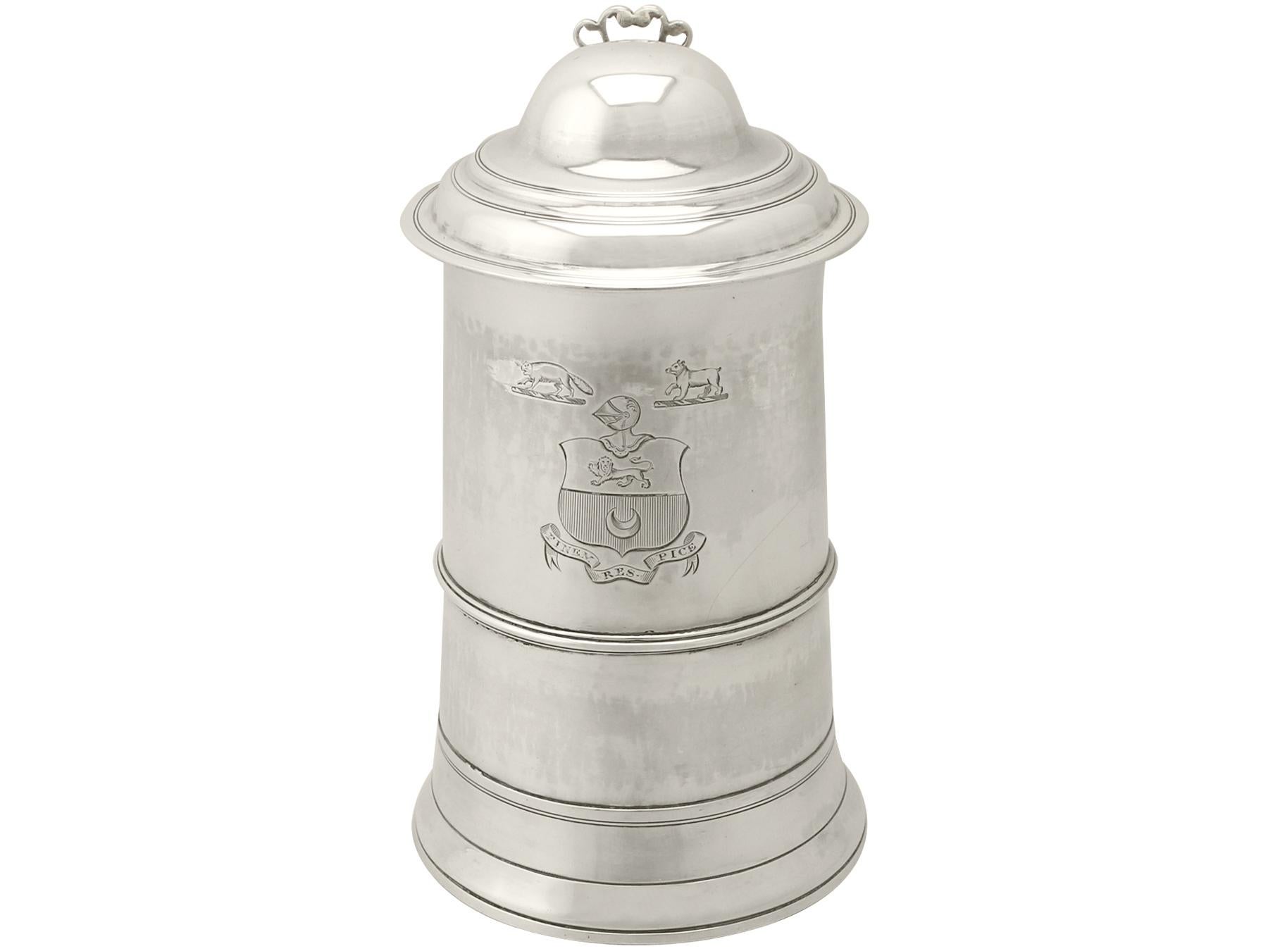 A fine and impressive antique George III English sterling silver quart tankard, an addition to our silver Georgian tankard collection

This exceptional antique George III sterling silver pint and a half tankard has a plain cylindrical tapering