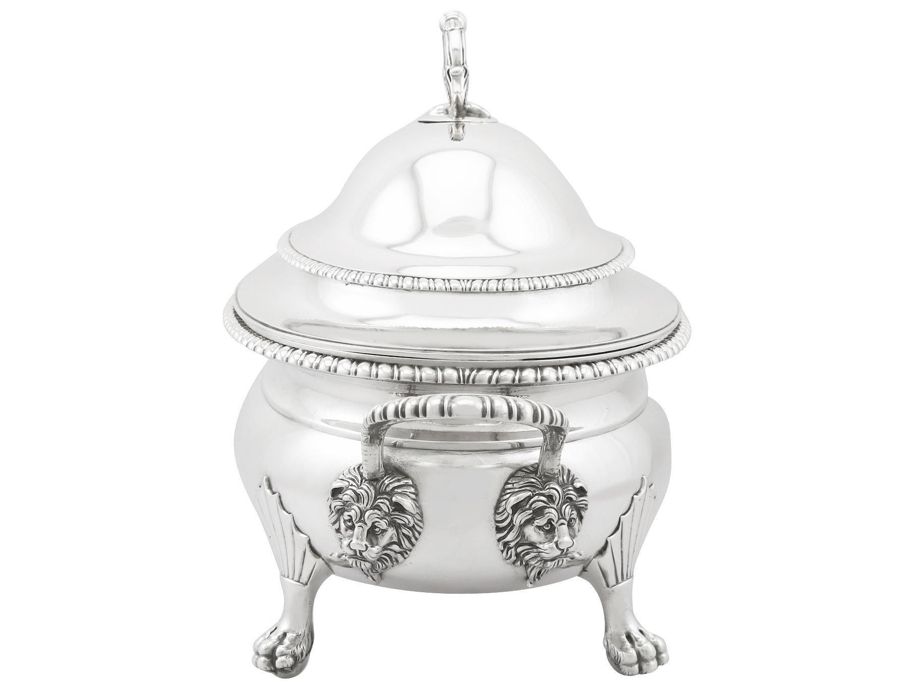 An exceptional, fine and impressive antique Georgian English sterling silver soup tureen; an addition to our collection of serving dishes.

This exceptional antique George III English sterling silver soup tureen has an oval rounded form.

The