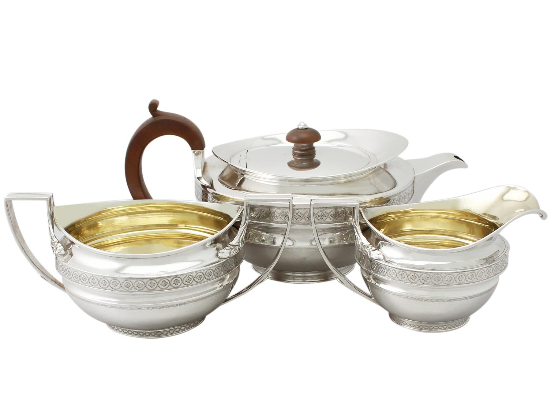 An exceptional, fine and impressive antique George III English sterling silver three piece tea service / Set; part of our silver teaware collection.

This exceptional antique George III sterling silver three piece tea service consists of a cream