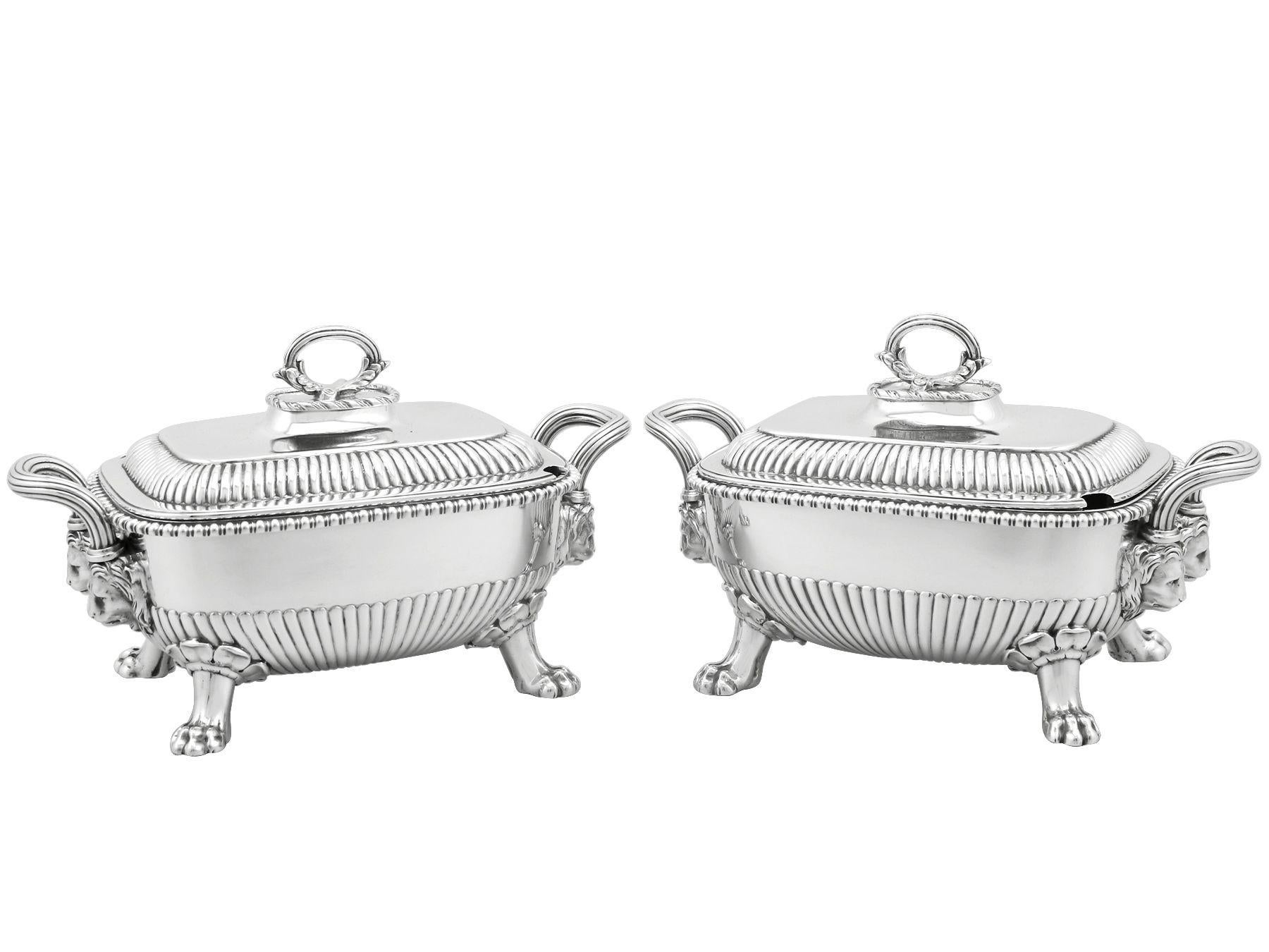 A magnificent, fine and impressive pair of antique George III English sterling silver sauce tureens; an addition to our Georgian silverware collection.

These magnificent antique George III sterling silver sauce tureens have a rectangular rounded