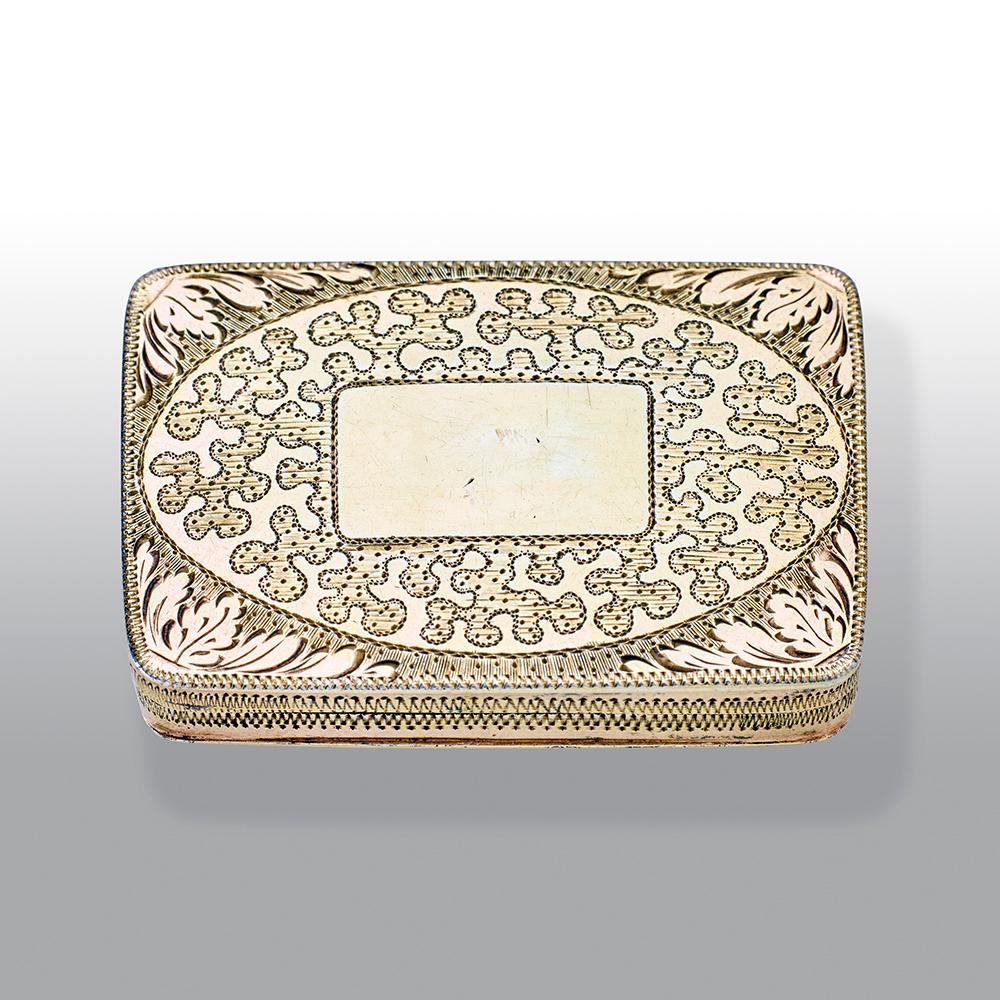 An extremely fine George III silver gilt vinaigrette rectangular cushion shape, the lid engraved with seaweed in panels, the interior with a pierced and engraved foliate grille.

Maker: Joseph Willmore, Birmingham, 1810

Weight: 21.90g.