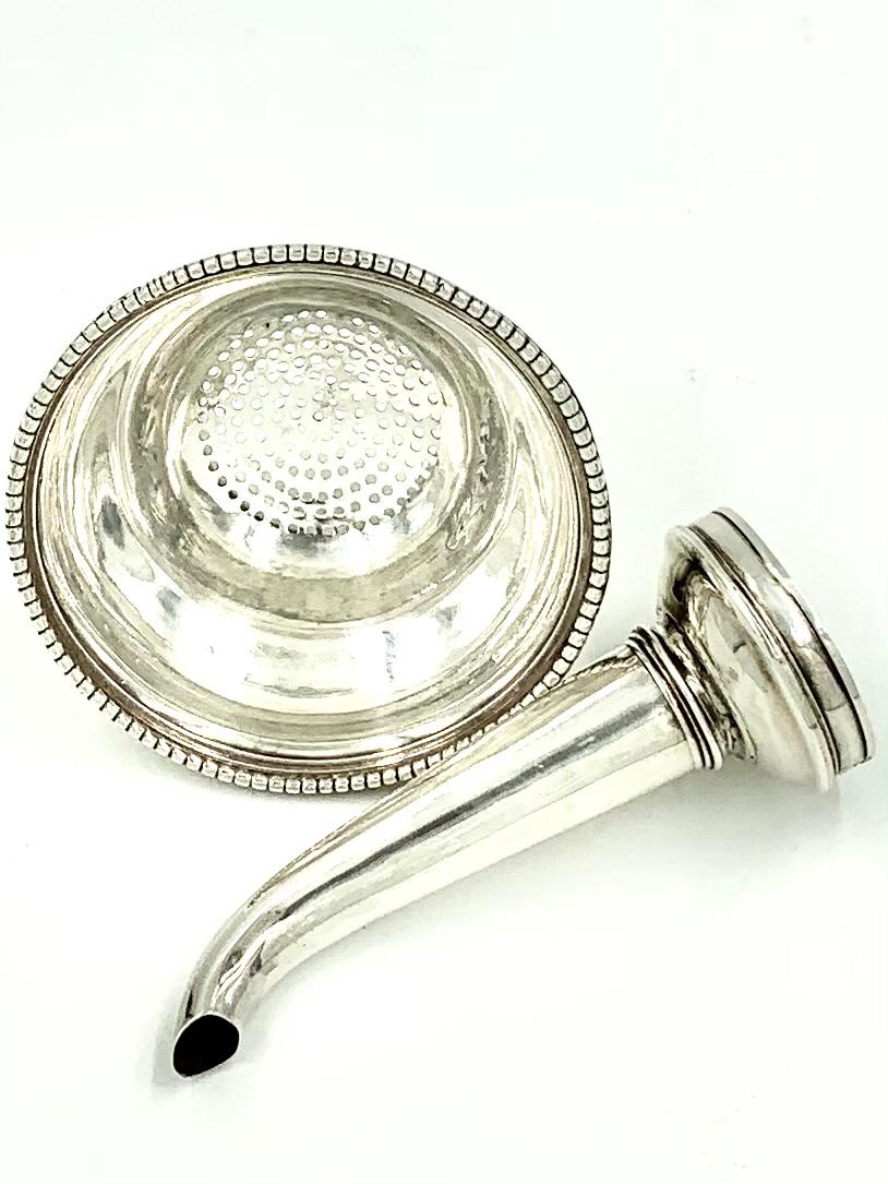 Fine George III period sterling silver two part wine funnel by Hester Bateman, 1777.
Beautiful lines, wonderful condition.
Hallmarked on the side of the rim between the spout and strainer, HB and on the strainer Lion Passant, London, b for