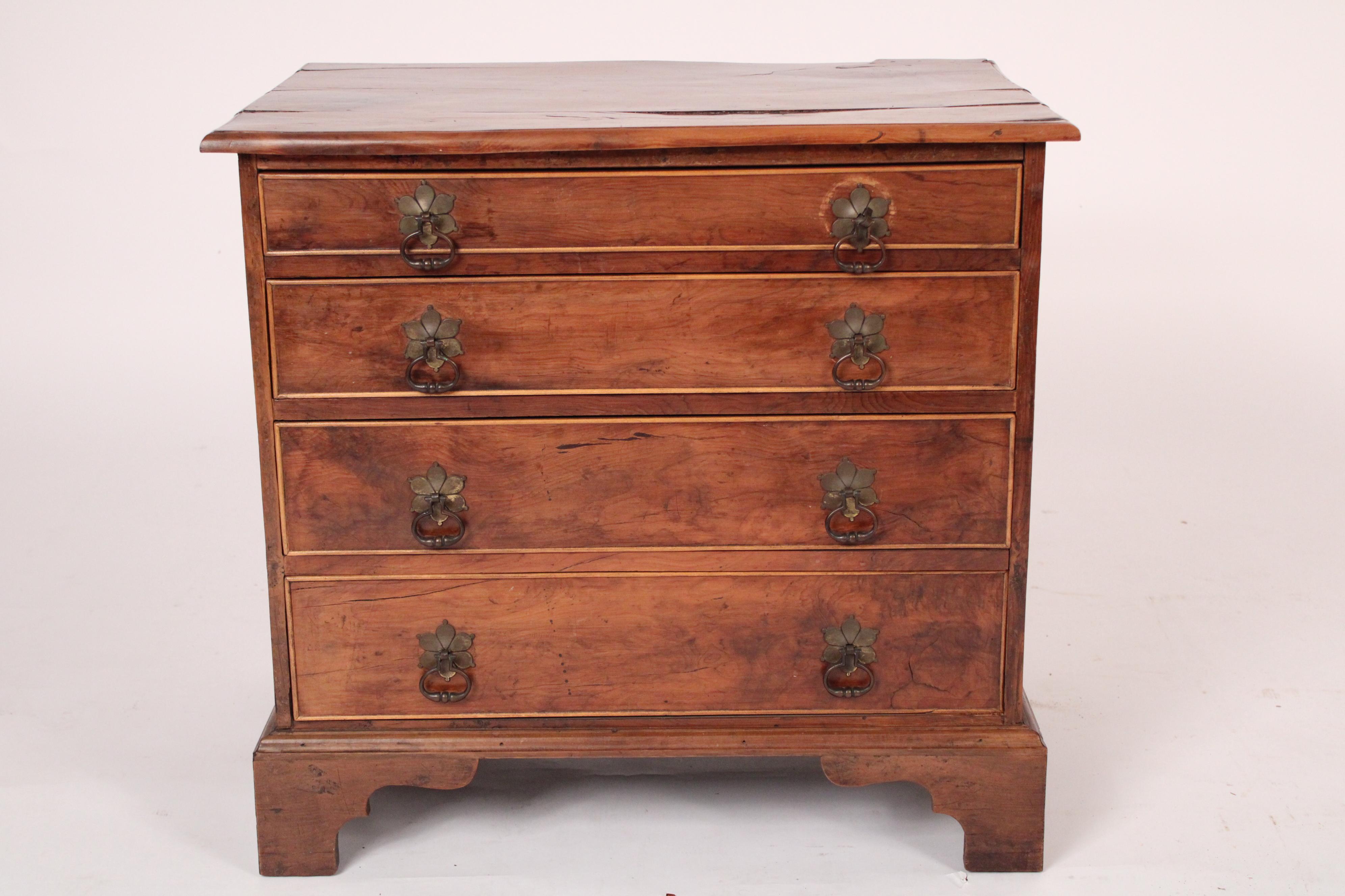 Antique George III style yew wood chest of drawers, circa 1900. With a rectangular yew wood top with molded front and side edges, 4 graduated drawers with brass pulls, resting on bracket feet. The yew wood has excellent old color. Hand dove tailed