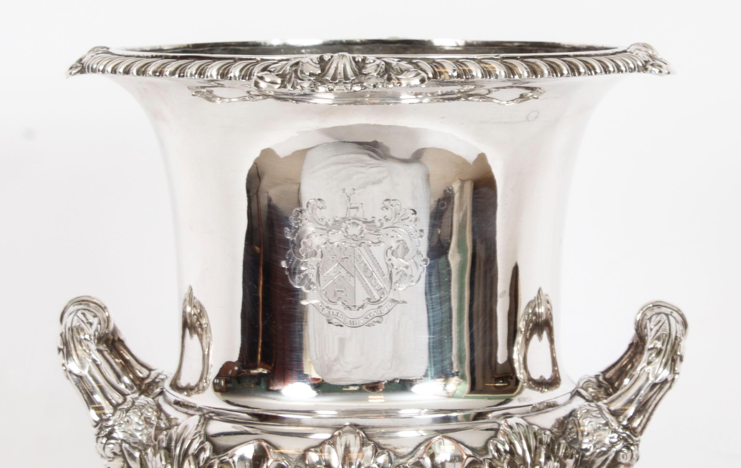 This is an elegant antique English Old Sheffield plate silver on copper ice bucket or wine cooler, circa 1790 in date, and bearing the sunburst makers marks of the world renowned silversmith Matthew Boulton.

The cooler is of campana baluster form
