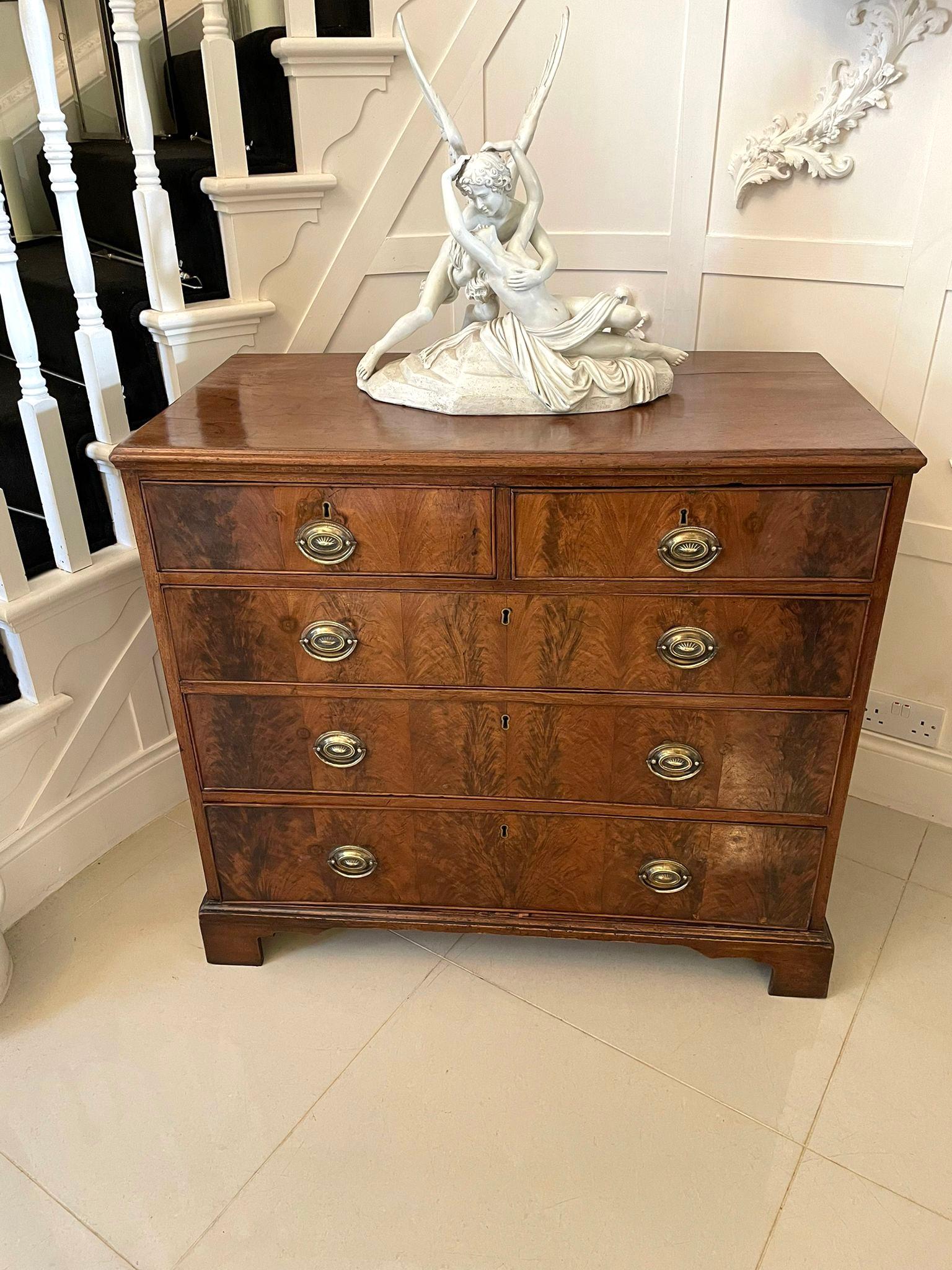 Antique George IIIl quality mahogany chest of five drawers having a quality mahogany top above two short and three long figured mahogany cockbeeded drawers with pretty oval brass handles and standing on original shaped bracket feet. 

Measures: H