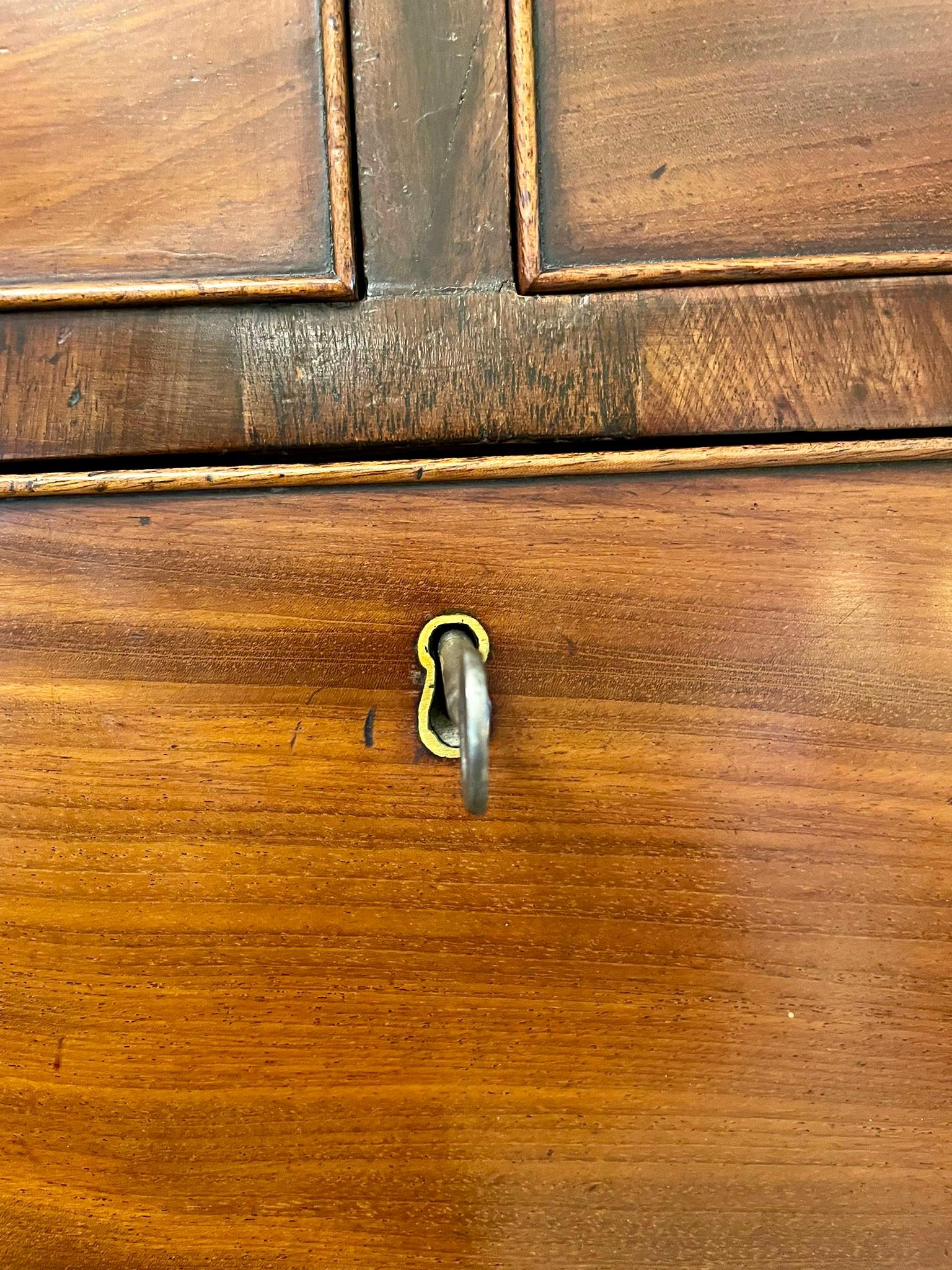 Antique George IIIl quality mahogany chest on chest having a quality dentil cornice above a fluted frieze, two short and three long cockbeeded drawers with brass handles flanked by reeded canted corners. 
The base has three long cockbeeded drawers