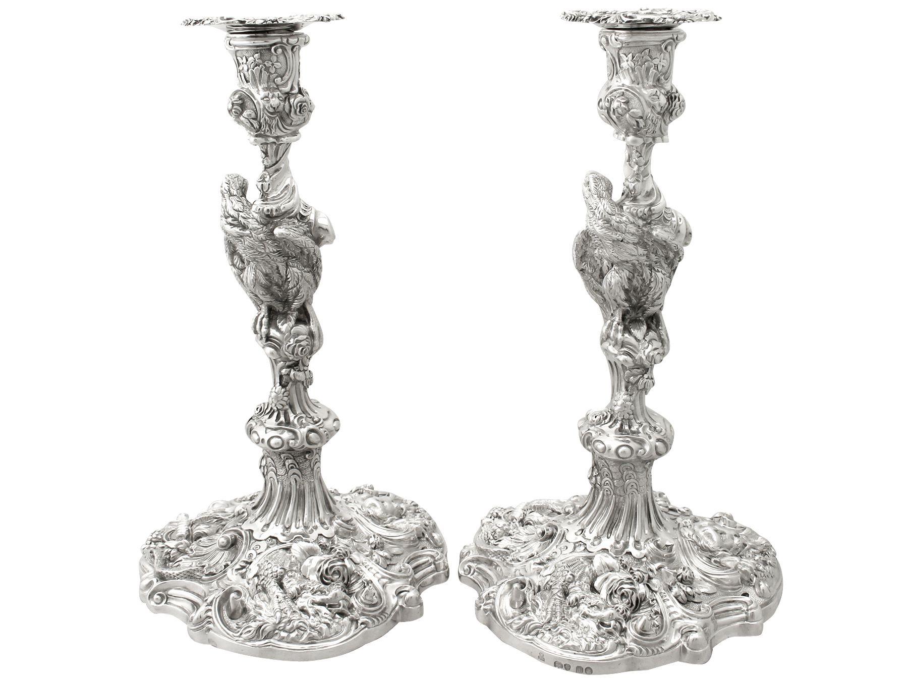 A magnificent, fine impressive pair of antique George IV English cast sterling silver candlesticks made by Robert Garrard II; an addition of our ornamental silverware collection

These magnificent antique George IV cast silver candlesticks, in