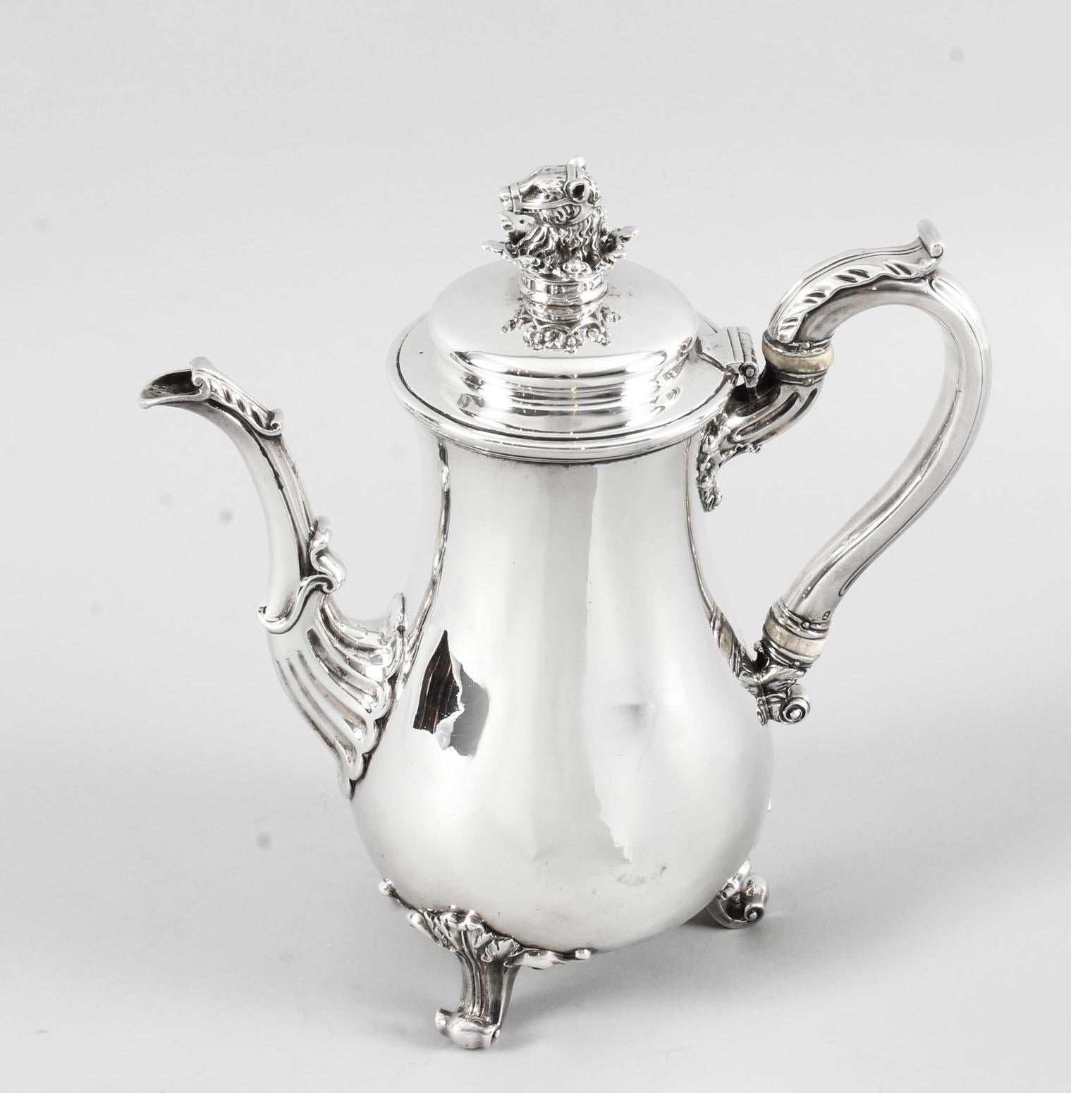 This is a wonderful English antique George IV sterling silver coffee pot by the world famous silversmith Paul Storr.

It has hallmarks for London 1826 and the makers mark of the celebrated silversmith Paul Storr. It bears a wonderful coat of arms