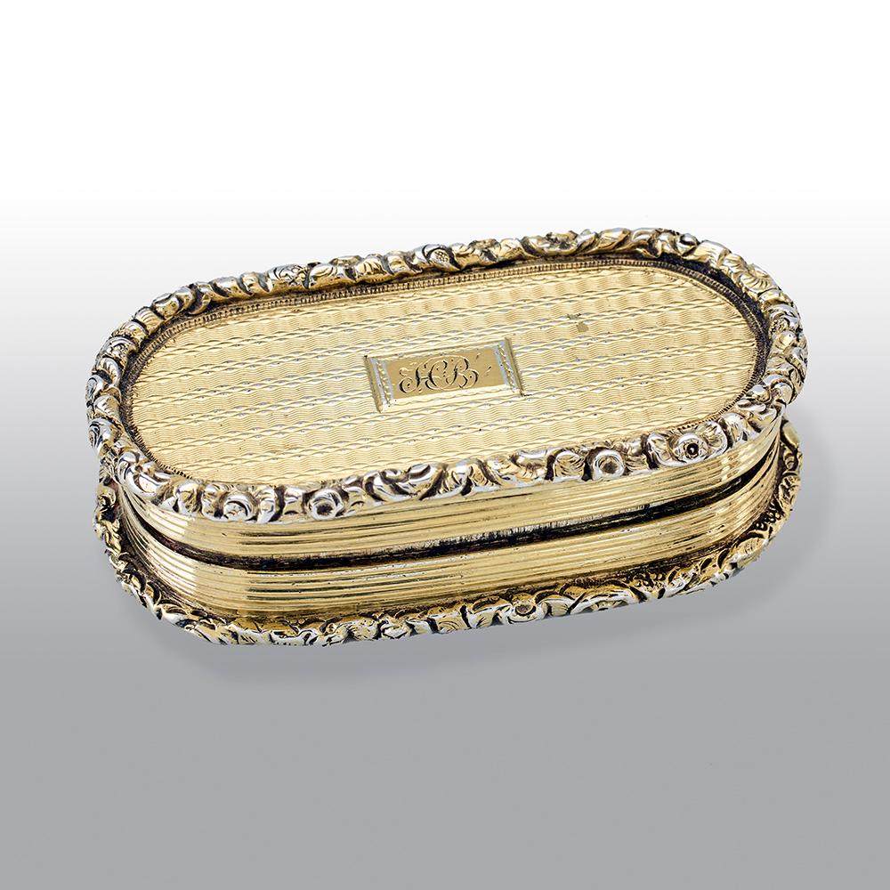 A fine George IV silver-gilt vinaigrette, slender rounded rectangular form, engine-turned decoration, the silver-gilt interior with a finely pierced and engraved foliate grille.

Maker: William Elliott, London, 1821

Weight: 35.6g.