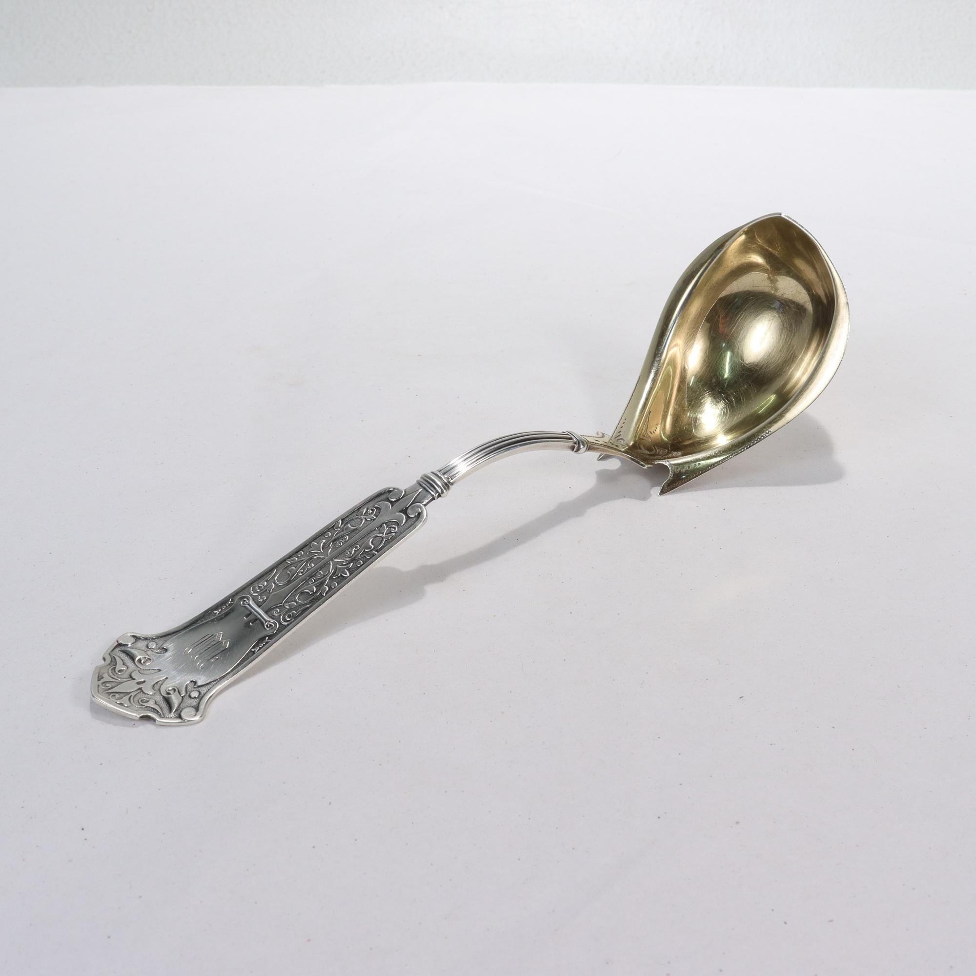 A fine antique antique American silver ladle.

By George B Sharp of Philadelphia, PA.

In coin silver.

With a gilding to both the bowl and an embossed arabesque pattern to the handle.

Simply a fine Sharp example!

Date:
Mid-19th Century

Overall