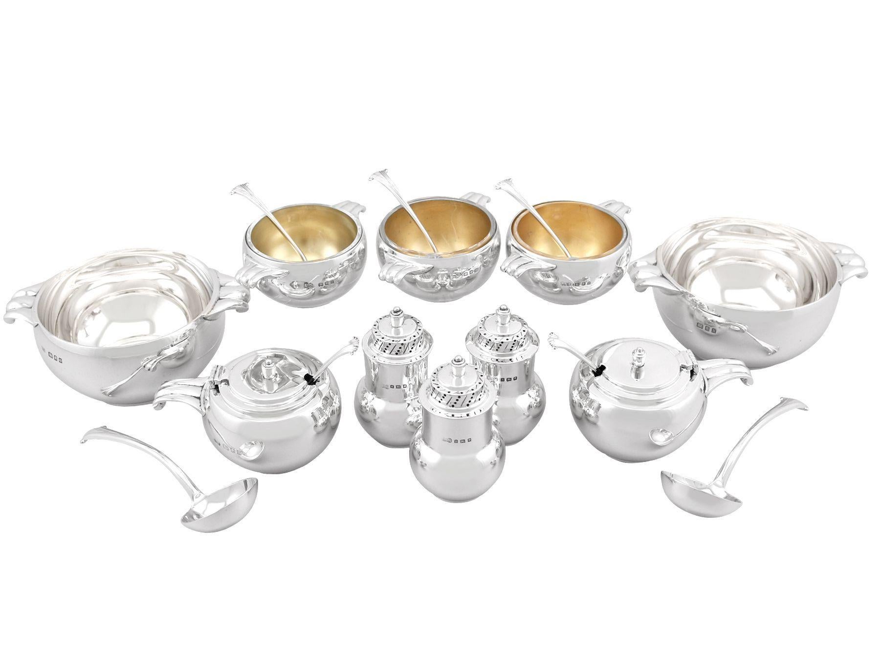 A magnificent, comprehensive and Art Deco antique George V English sterling silver twelve piece condiment set - boxed; an addition to our dining silverware collection.

This exceptional antique George V twelve piece silver condiment set consists