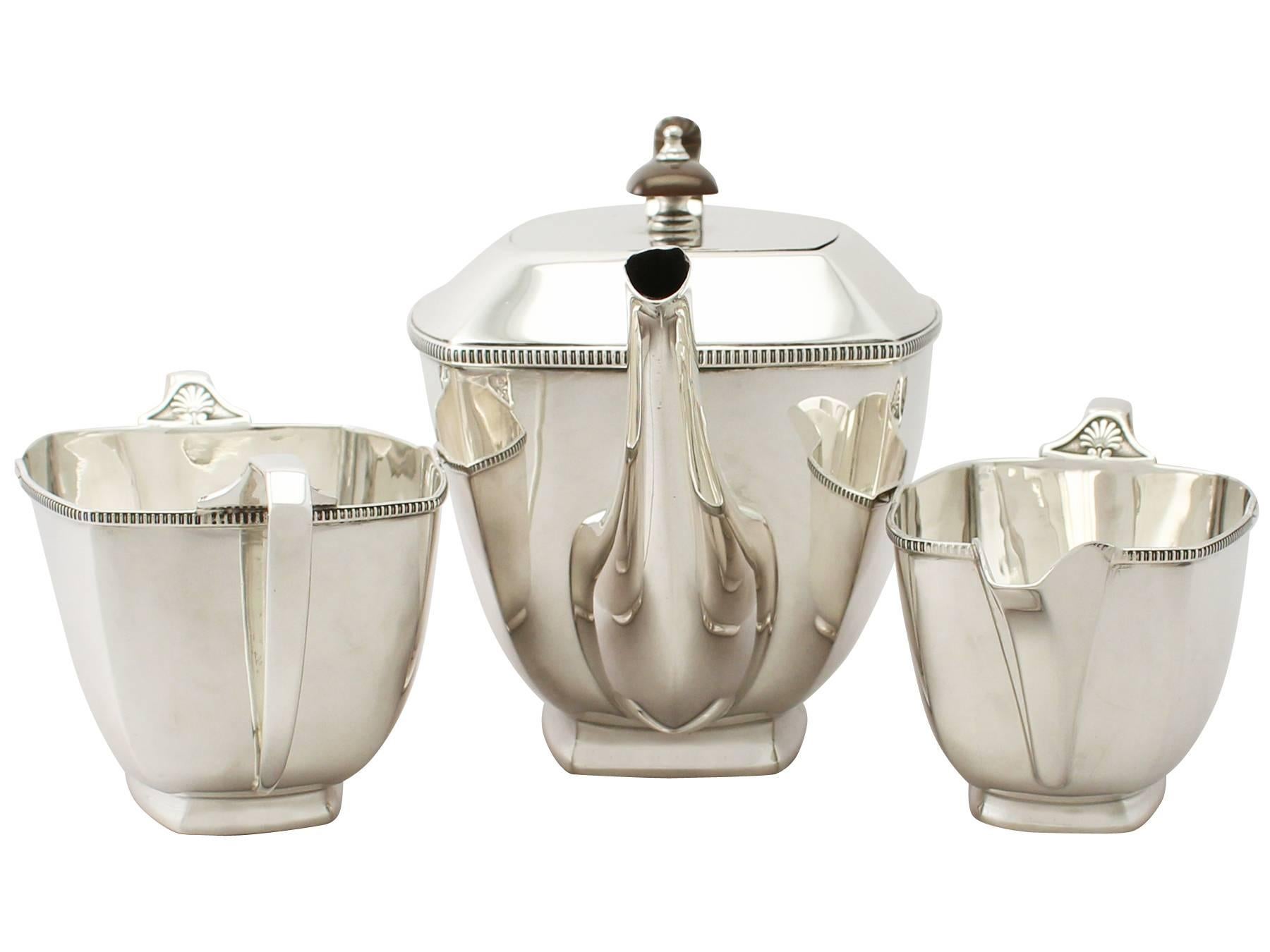 An exceptional, fine and impressive antique George V English sterling silver three-piece tea service made in the Art Deco style; an addition to our teaware collection

This exceptional antique George V sterling silver three-piece tea set consists