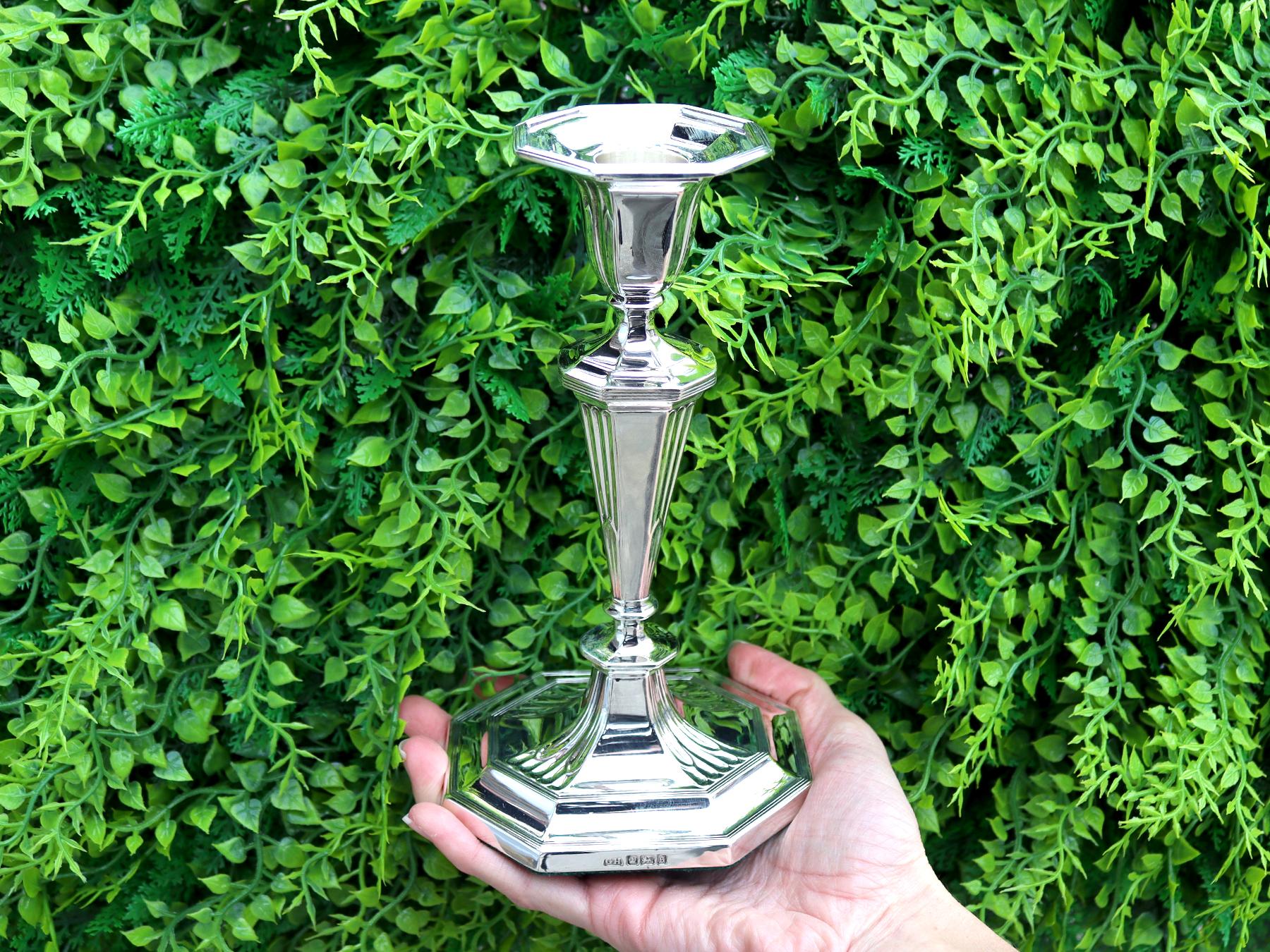 An exceptional, fine and impressive pair of antique George V English sterling silver candlesticks; an addition to our antique silverware collection.

These exceptional, fine and impressive antique George V sterling silver candlesticks have a plain