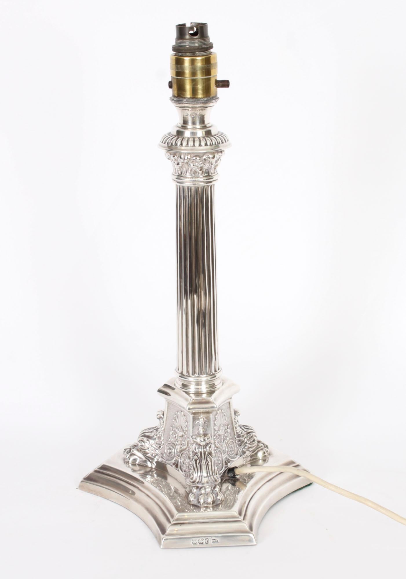 This is an impressive antique George V sterling silver Corinthian column table lamp bearing hallmarks for Sheffield 1923 and the makers mark of the renowned Sheffield silversmith Walker and Hall.

It features a classic Corinthian Capital decorated
