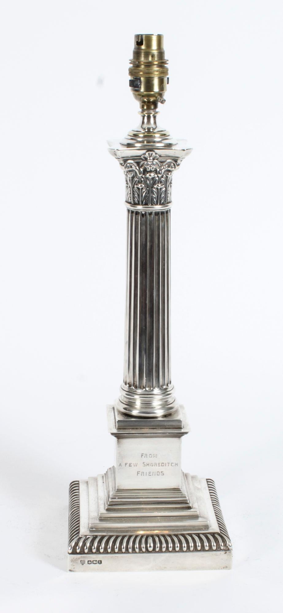 This is an impressive large antique George V sterling silver Corinthian column table lamp bearing hallmarks for Sheffield 1928 and the makers mark of the renowned silversmith Hawksworth, Eyre & Co Ltd
 
It features a classic Corinthian Capital