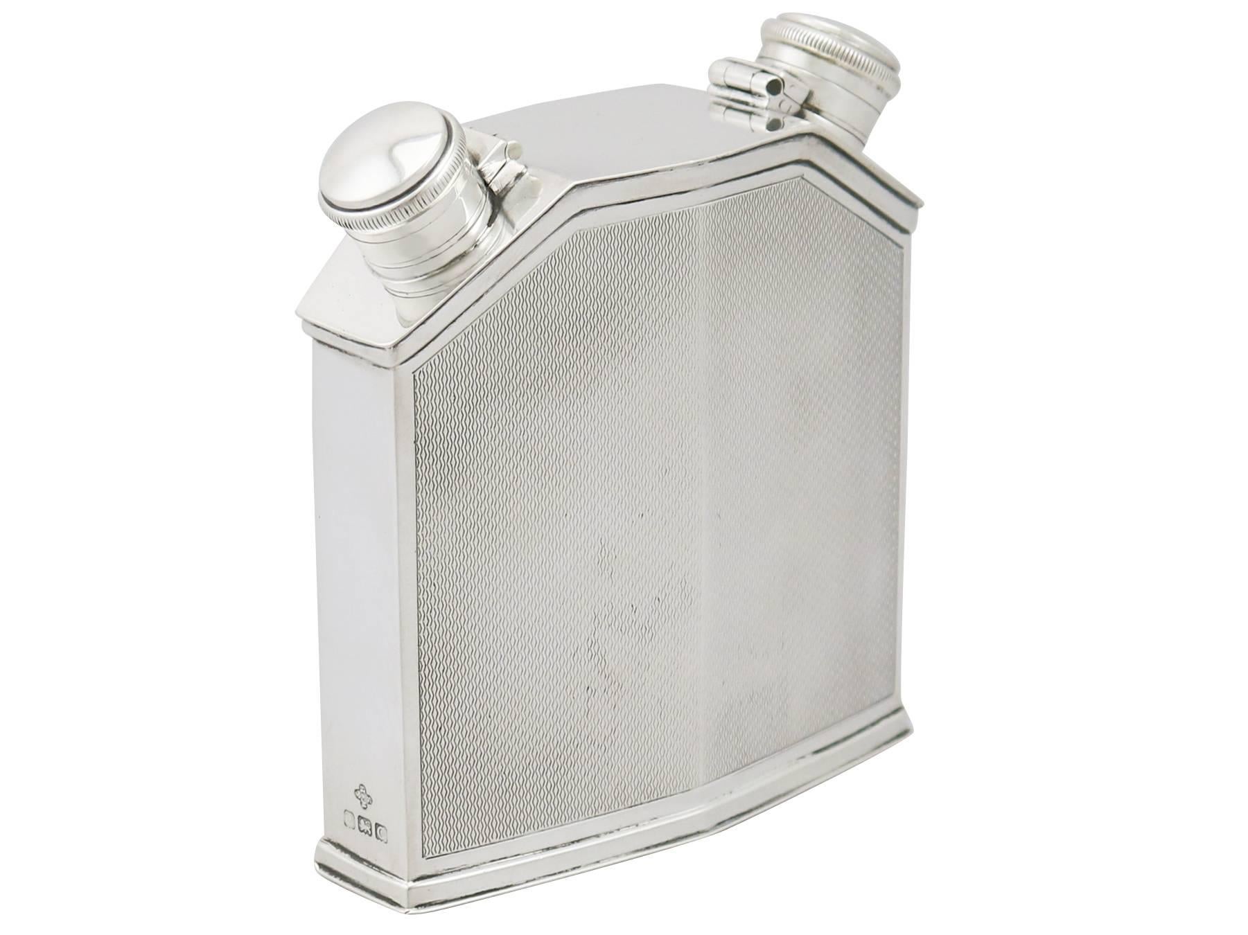 An exceptional, fine and impressive antique George V English sterling silver double hip flask; part of our wine and drinks related silverware collection.

This exceptional antique George V double hip flask in sterling silver has been modelled in