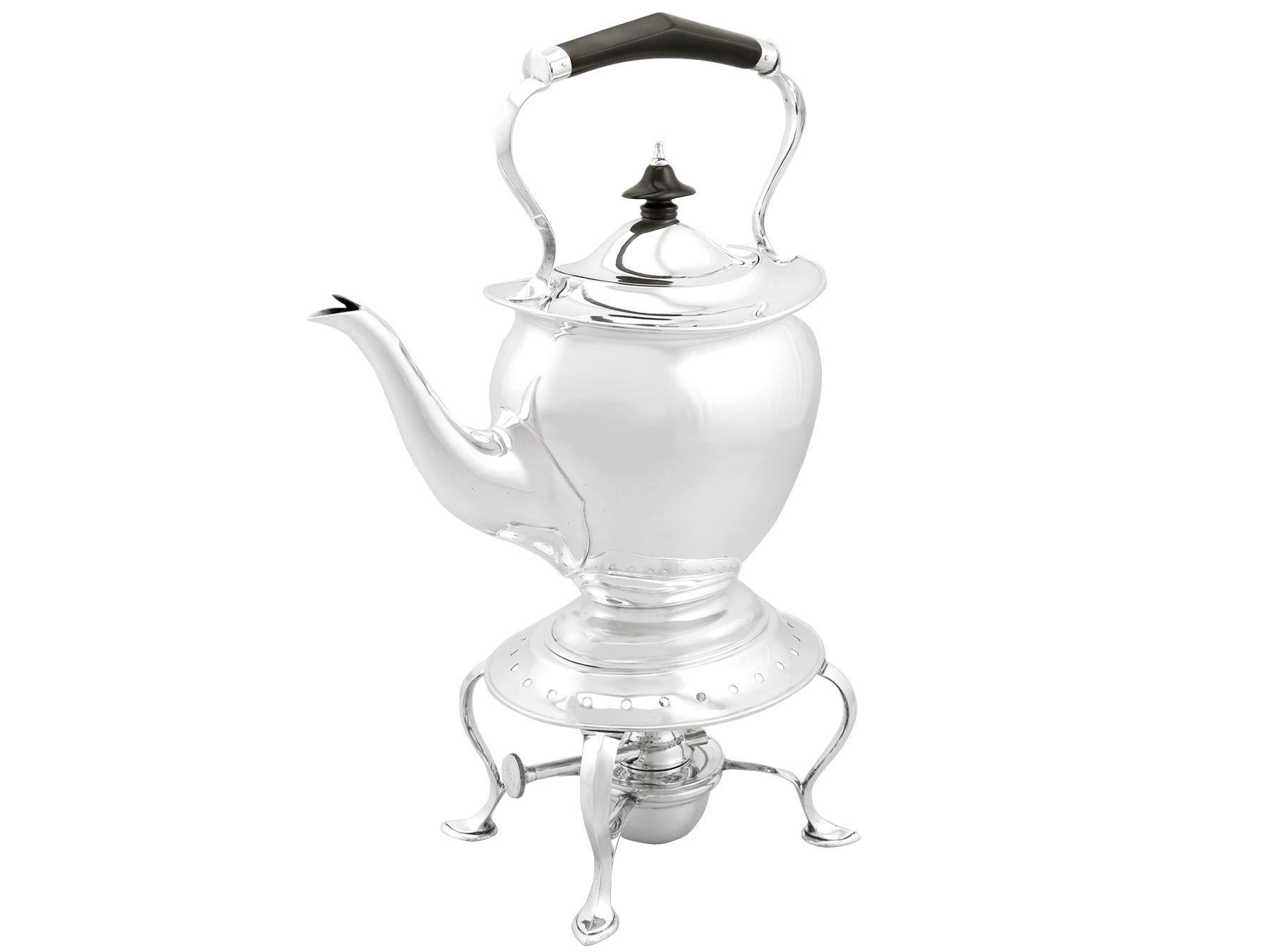 An exceptional, fine and impressive antique George V English sterling silver four piece tea service/set; part of our silver teaware collection

This exceptional antique George V sterling silver 4 piece tea set consists of a spirit kettle, teapot,