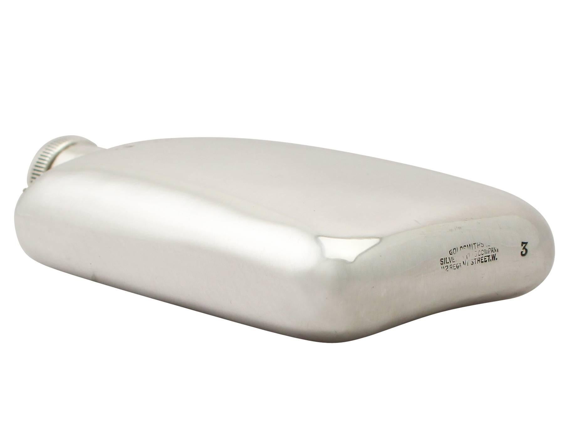 An exceptional, fine and impressive antique George V English sterling silver hip flask; part of our wine and drinks related silverware collection.

This exceptional antique George V sterling silver hip flask has a rectangular form with rounded
