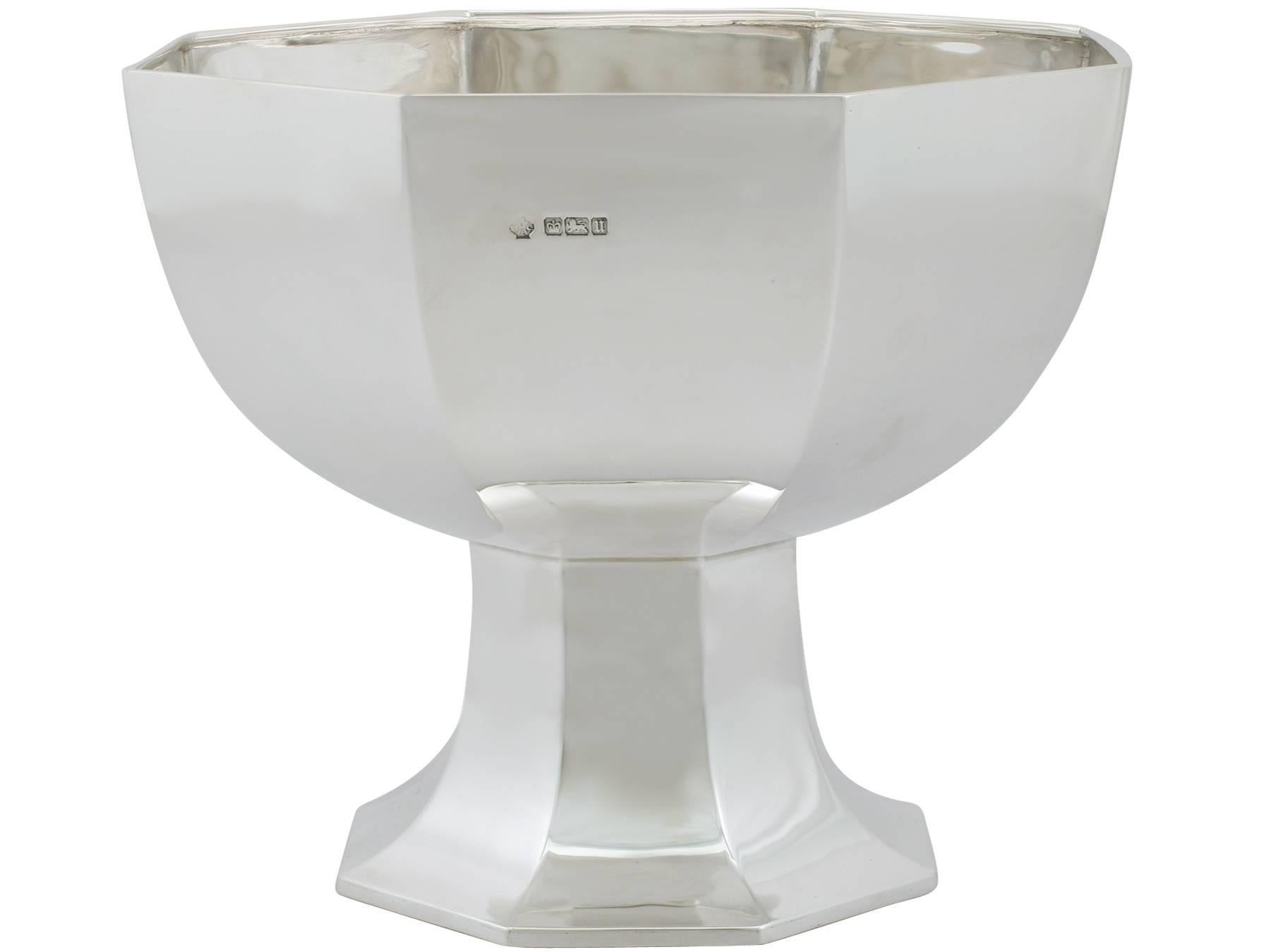 A fine and impressive antique George V English sterling silver presentation bowl; an addition to our presentation silverware collection

This fine antique George V sterling silver presentation bowl has a plain rounded octagonal panelled