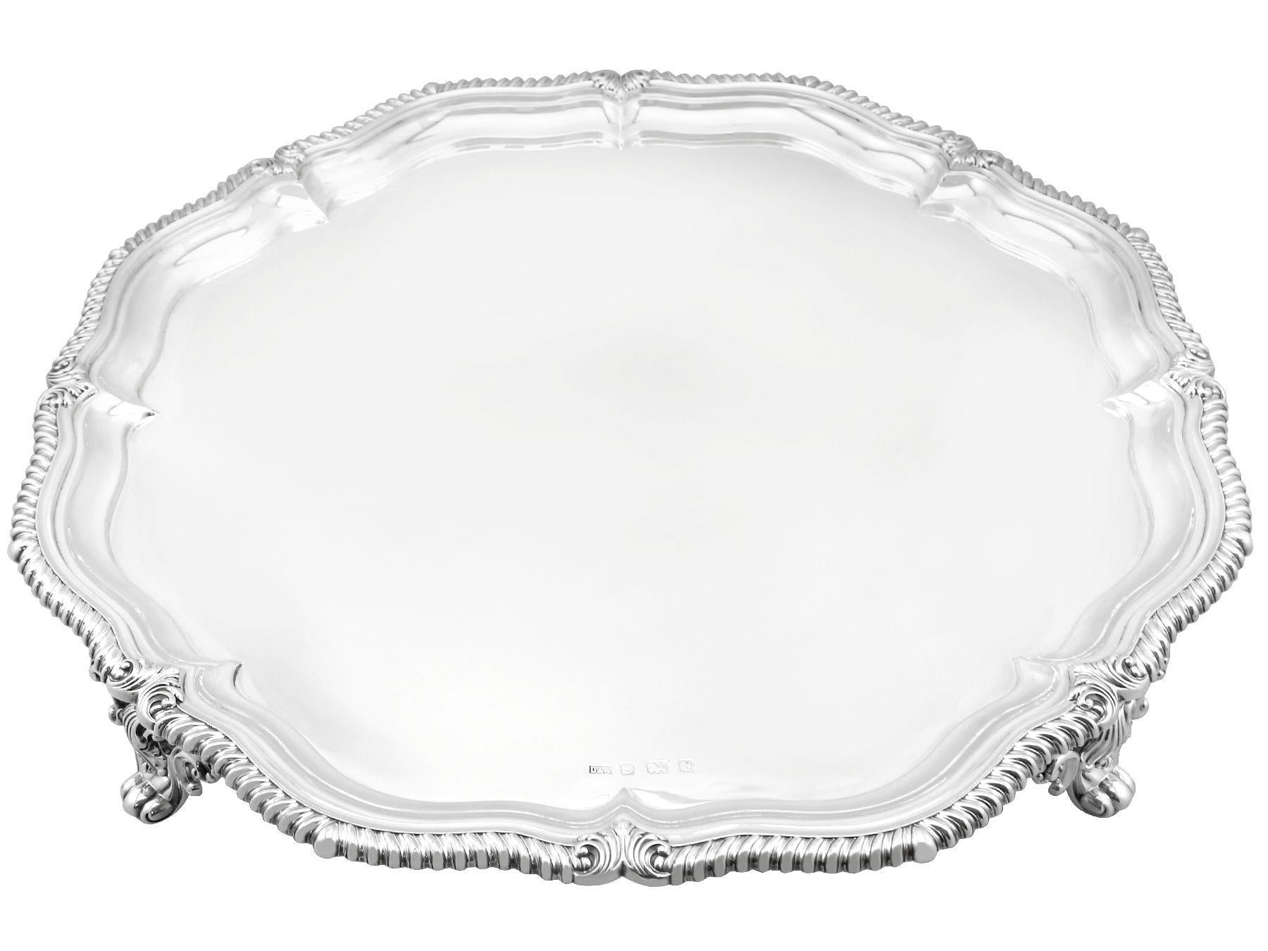 A magnificent, fine and impressive, large antique George V English sterling silver salver; an addition to our silver dining collection

This magnificent antique George V English sterling silver salver has a circular shaped form onto four