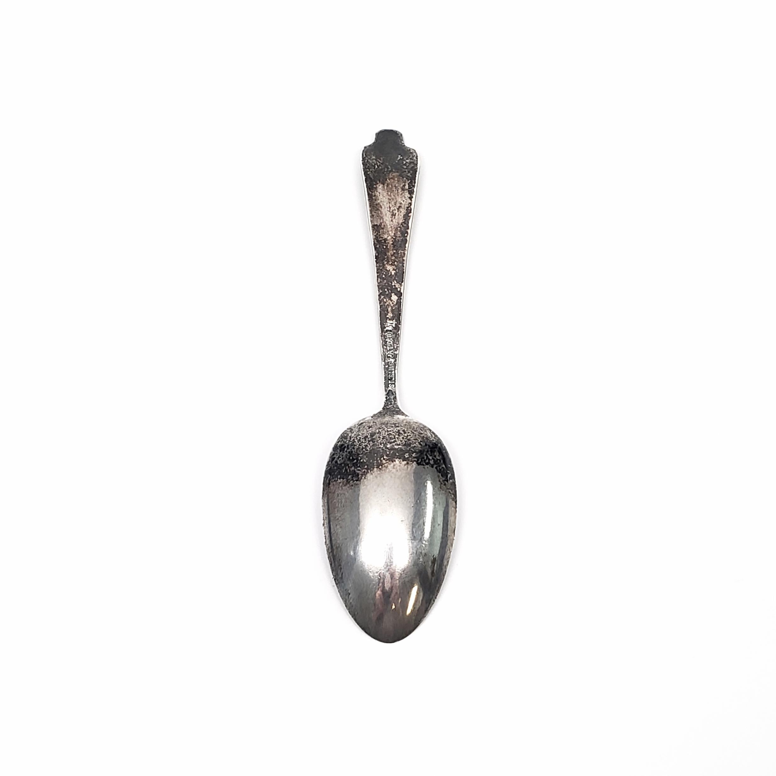 Antique sterling silver teaspoon in the Flora pattern, #1 Primrose, by George W Shiebler.

George Shiebler is known for his distinctive silver patterns. Flora is an innovative, multi-motif pattern designed in 1889 in the Art Nouveau style. Flora has