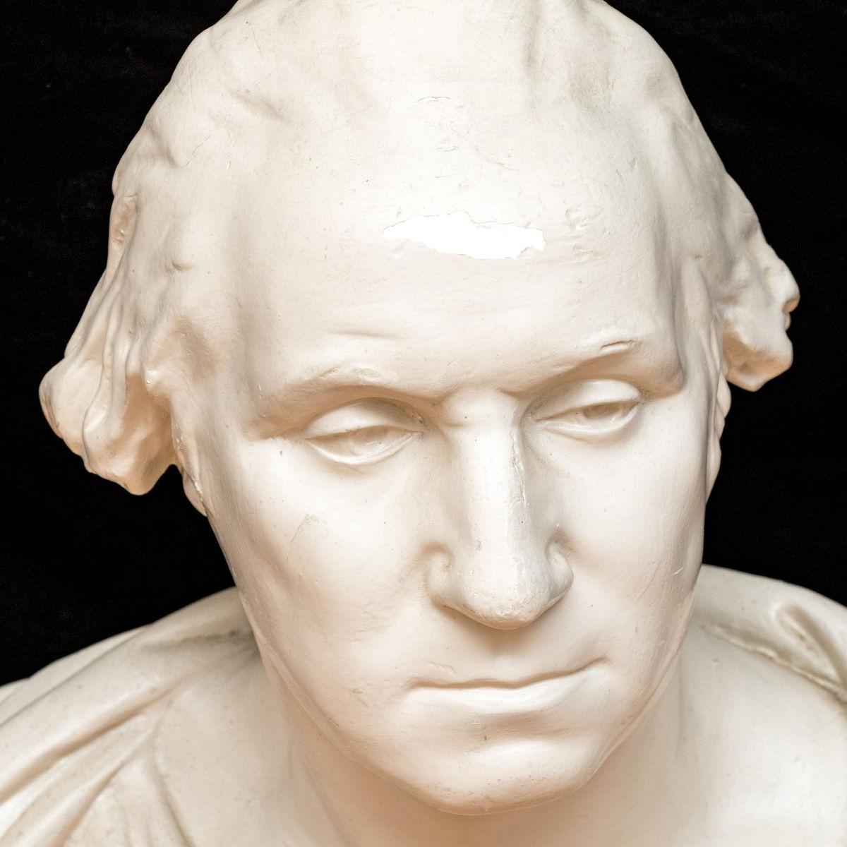 Fine antique molded plaster bust sculpture of President George Washington after the original model by Jean-Antoine Houdon created in 1785, cast by the widely admired P.P. Caproni of Boston in the early 20th century.  With impressed mark of the
