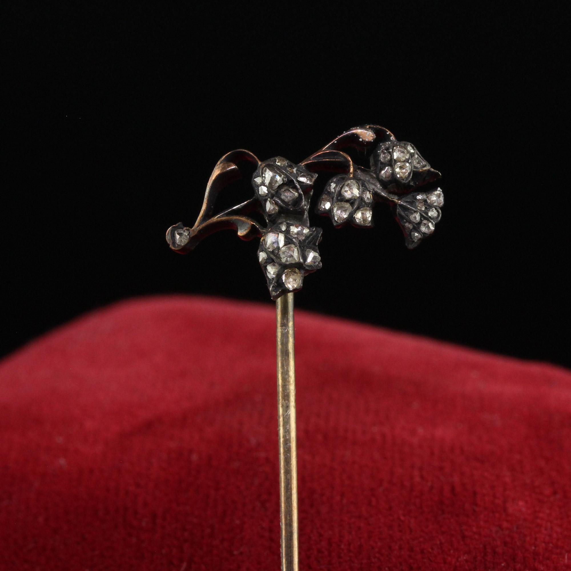 Beautiful Antique Georgian 10K Yellow Gold Silver Top Diamond Floral Stick Pin. This beautiful stick pin is crafted in 10k yellow gold and silver. The pin features a beautiful floral design that has old cut diamonds set on top. The pin tests as 10k