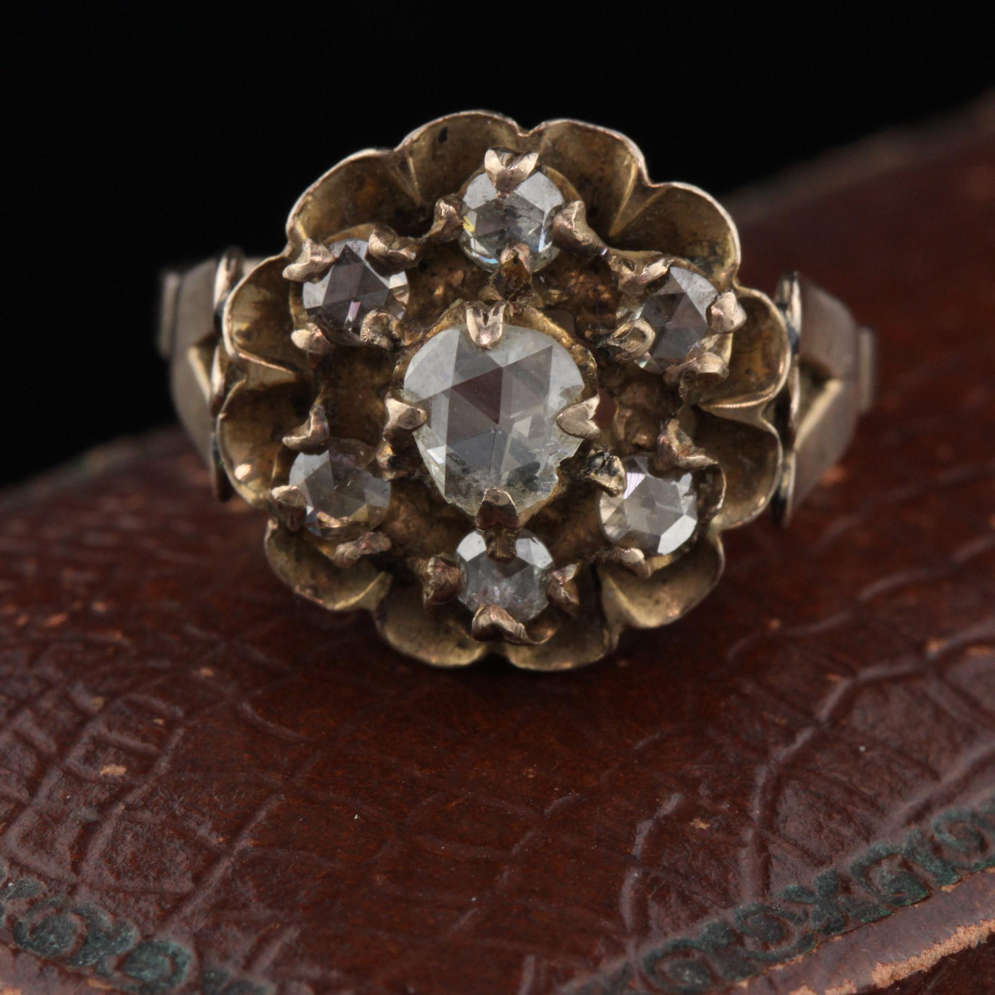 This beautiful Georgian cluster ring with rose cut diamonds is a piece of history! The center diamond is chipped, as it is such an old piece. This only adds to the character and beauty of the ring.

Metal: 10K Yellow Gold

Diamonds: Approximately