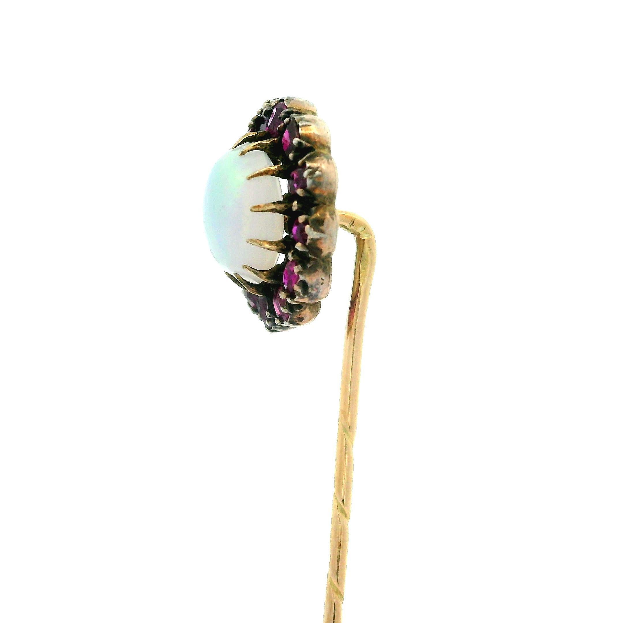 –Stone(s)–
(1) Natural Genuine Opal - Round Cabochon - Prong Set - White Base w/ Orange & Violet Color Play - 8mm (approx.)
(14) Natural Genuine Rubies - Old Mixed Cut - Prong Set - Red Wine Color - 0.35ctw (approx.)

Material: 14k Yellow Gold Pin -