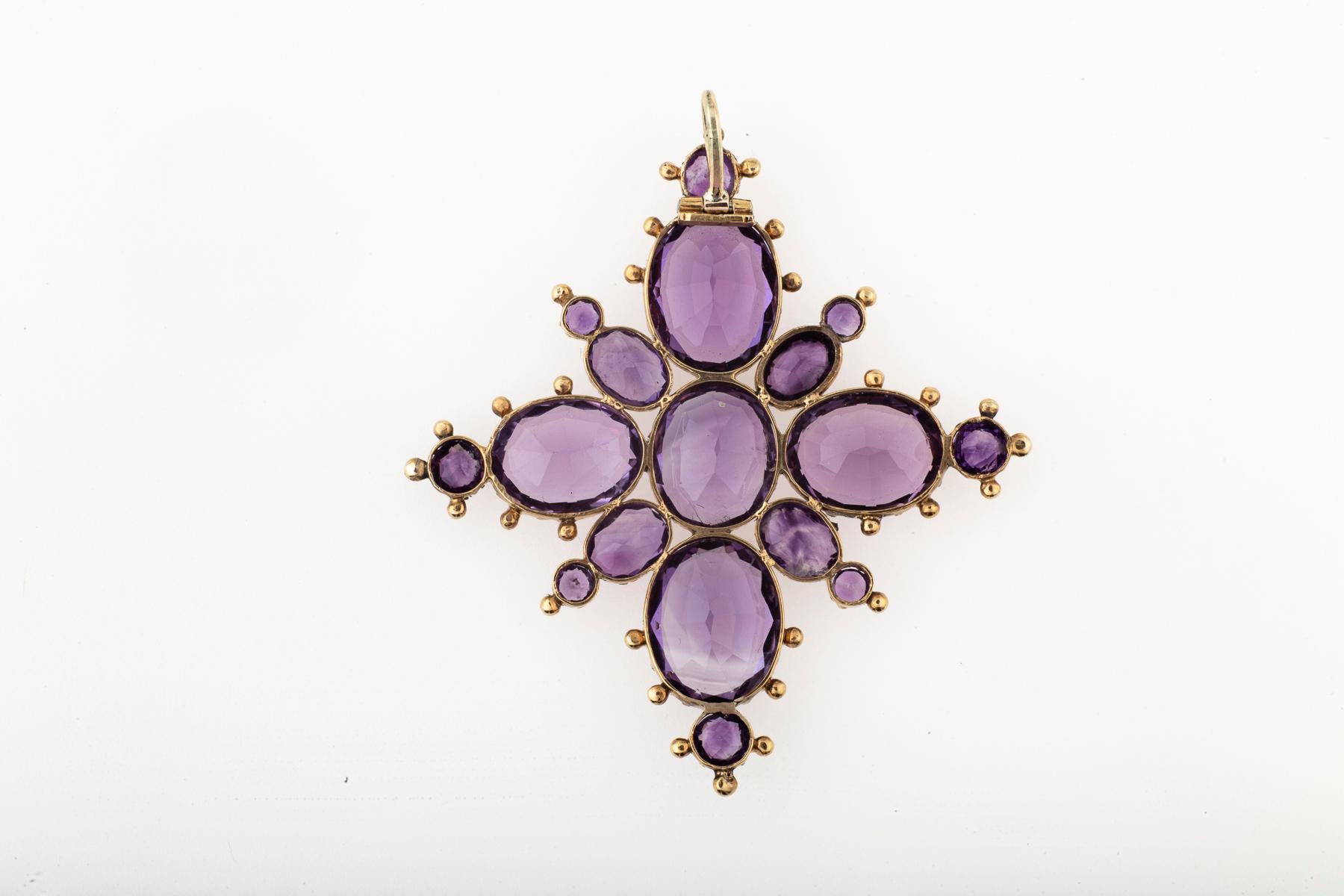 The color is royal in this genuine Georgian Amethyst Star or Snowflake pendant c. 1820. The small orbs around the gems are called granulation. They are little beads of gold that jewelers adhered to the gold settings without glue or solder. The