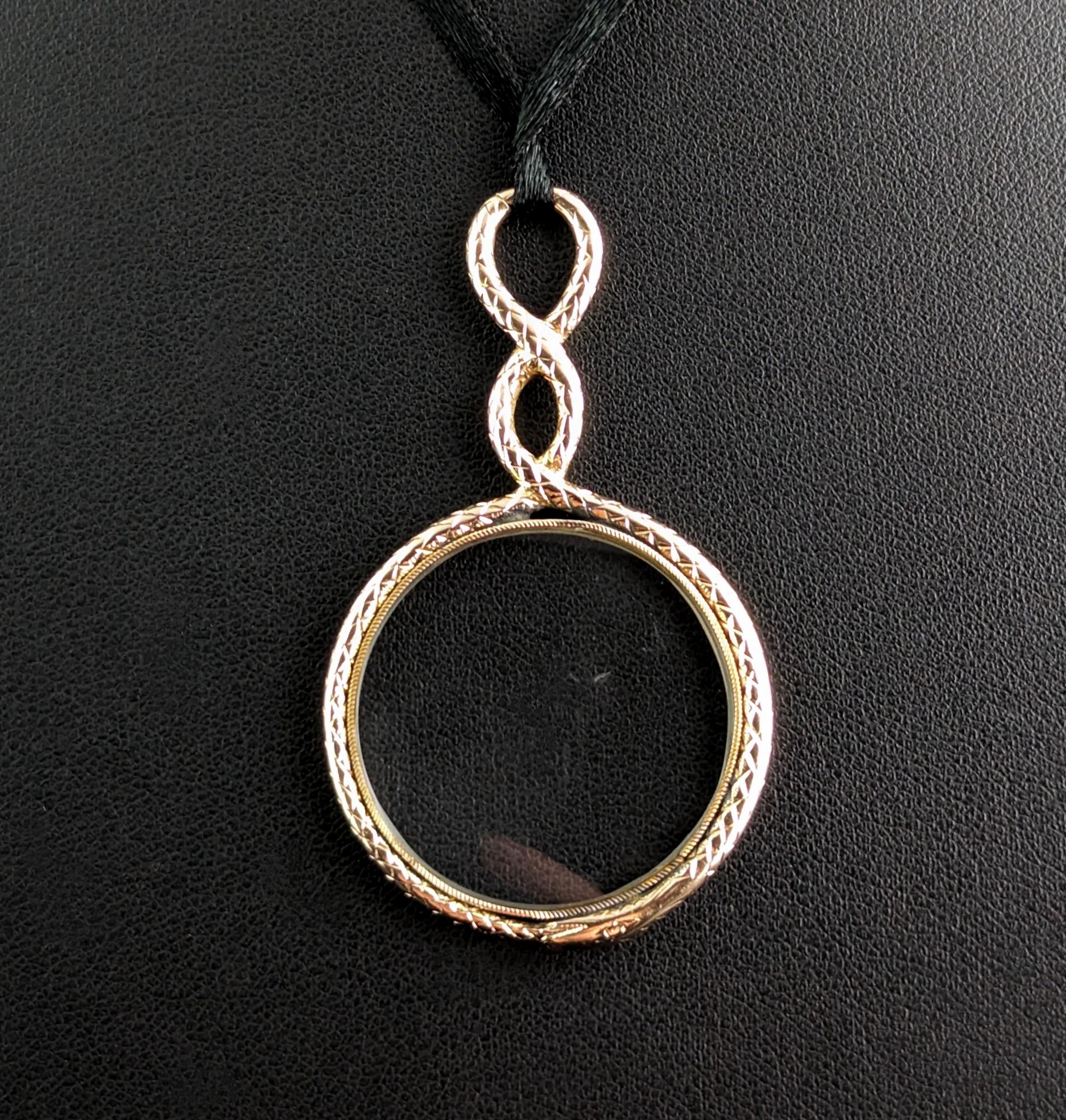 There is nothing not to love about this stunning antique, Georgian era ouroboros gold quizzing glass pendant!

Usually worn around the neck on a ribbon or chain for ease of use, these beautiful decorative pieces really were a functional piece of