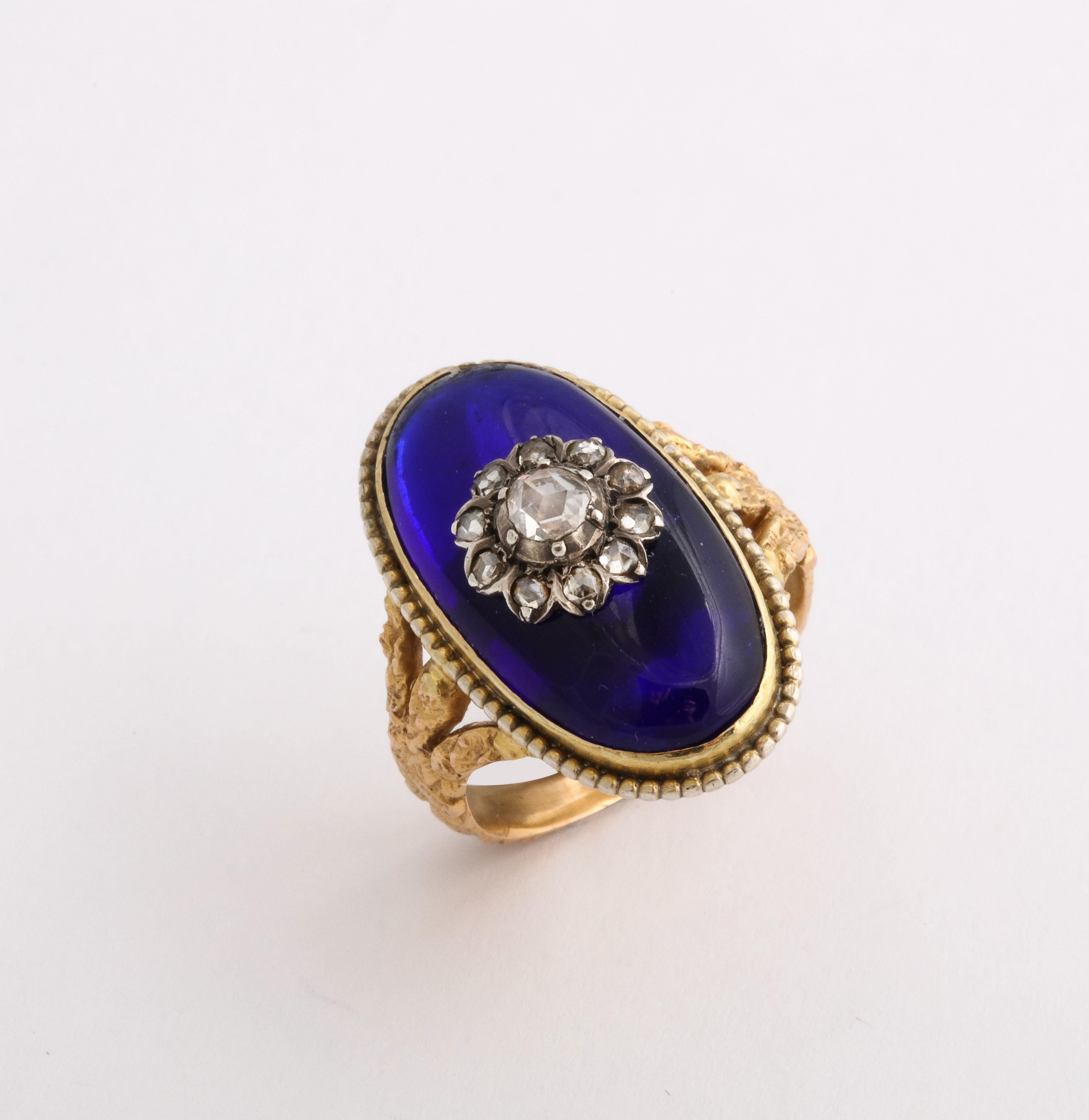 An outstanding Bristol Blue, almost neon Vitreous Glass Baque Au Firmament Ring in 18 Kt gold and sterling silver. NOTE, any marks on the ring are reflections of light. The ring is in excellent condition. Collectors and connoisseurs recognize the