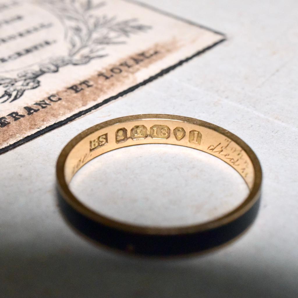 A superb 198 year old ring fully hallmarked for manufacture in London 1826, designed as a mourning ring commemorating the passing for a gentleman ‘John Milnes Waraker’ in 1826.

Crafted from 18ct yellow gold and black enamel and, we believe highly
