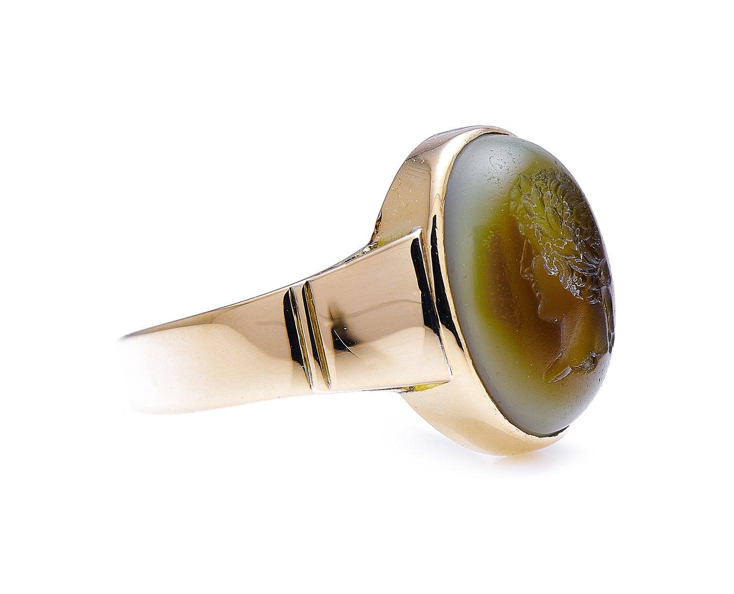Chalcedony intaglio ring. Intaglios are carved stones, but unlike cameos, where the design protrudes in relief, the design of an intaglio is carved into the stone, in concave relief. This pale green chalcedony with a brownish tinge is intricately
