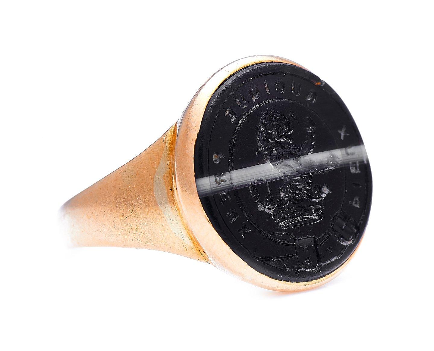 Onyx intaglio ring, 18th century. This ring is set with a striking black onyx with an expertly centred stripe of white – a much-sought after pattern in onyx in the latter half of the 19th century. This beautiful section of onyx is intricately carved