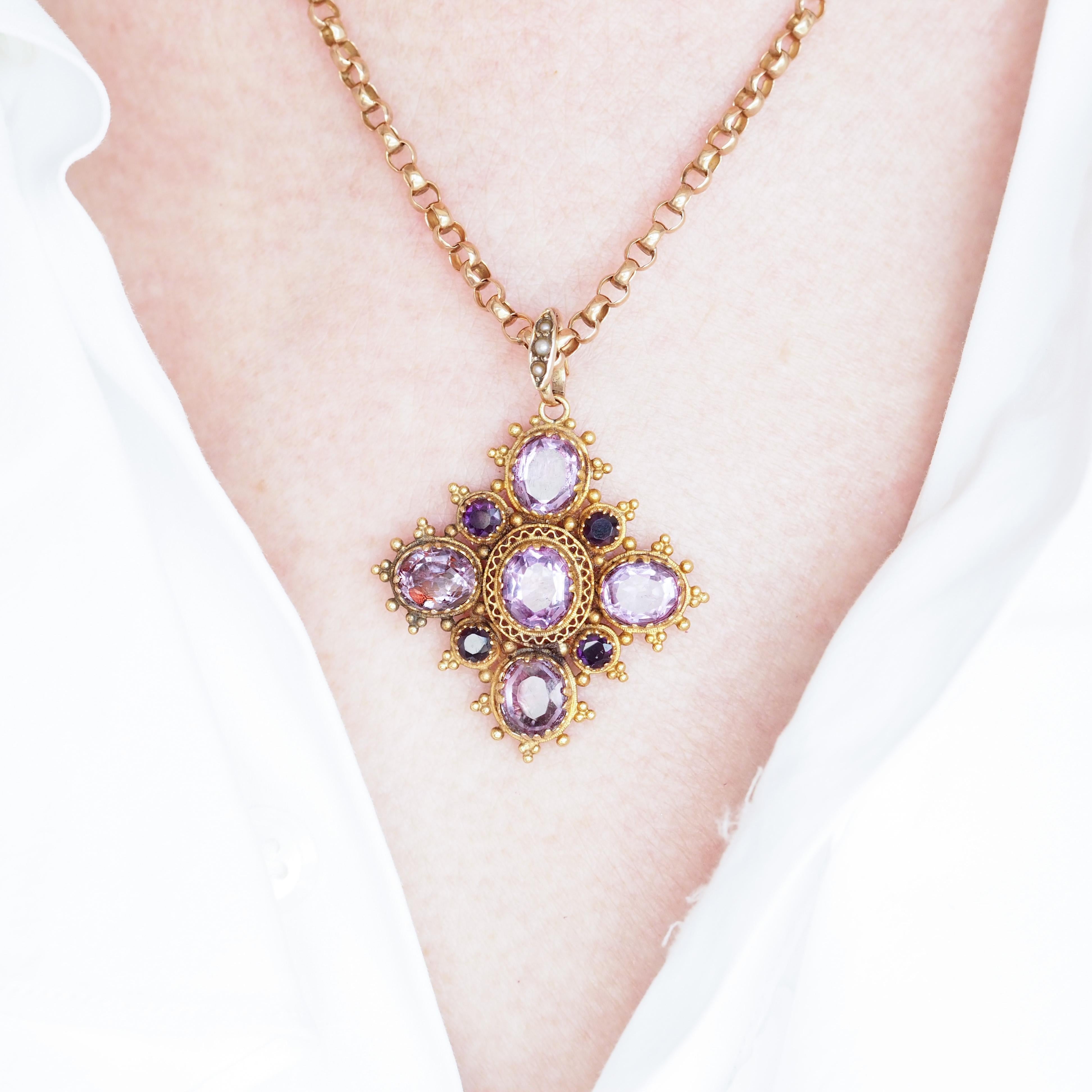 We are delighted to offer this gorgeous Georgian antique 18ct amethyst pendant made c.1820. 

The pendant features a lovely multi stone design with fine cannetille work in between. Cannetille, a technique similar to filigree work was popular in the