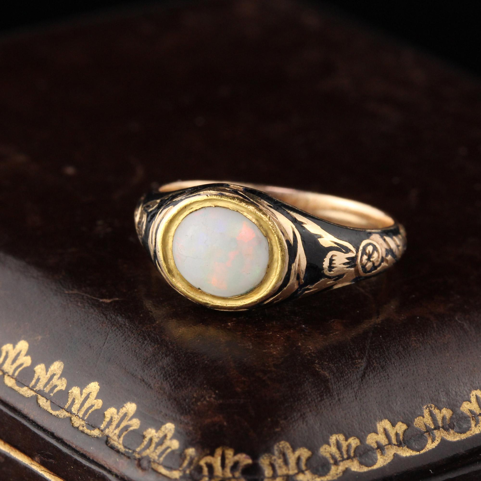 Beautiful Georgian Signet ring with a horizonally set oval opal in the center of the yellow gold & black enamel mounting. In very good condition for its age with some enamel loss. See images. Makes an awesome pinky ring!

#R0394

Metal: 18KYellow
