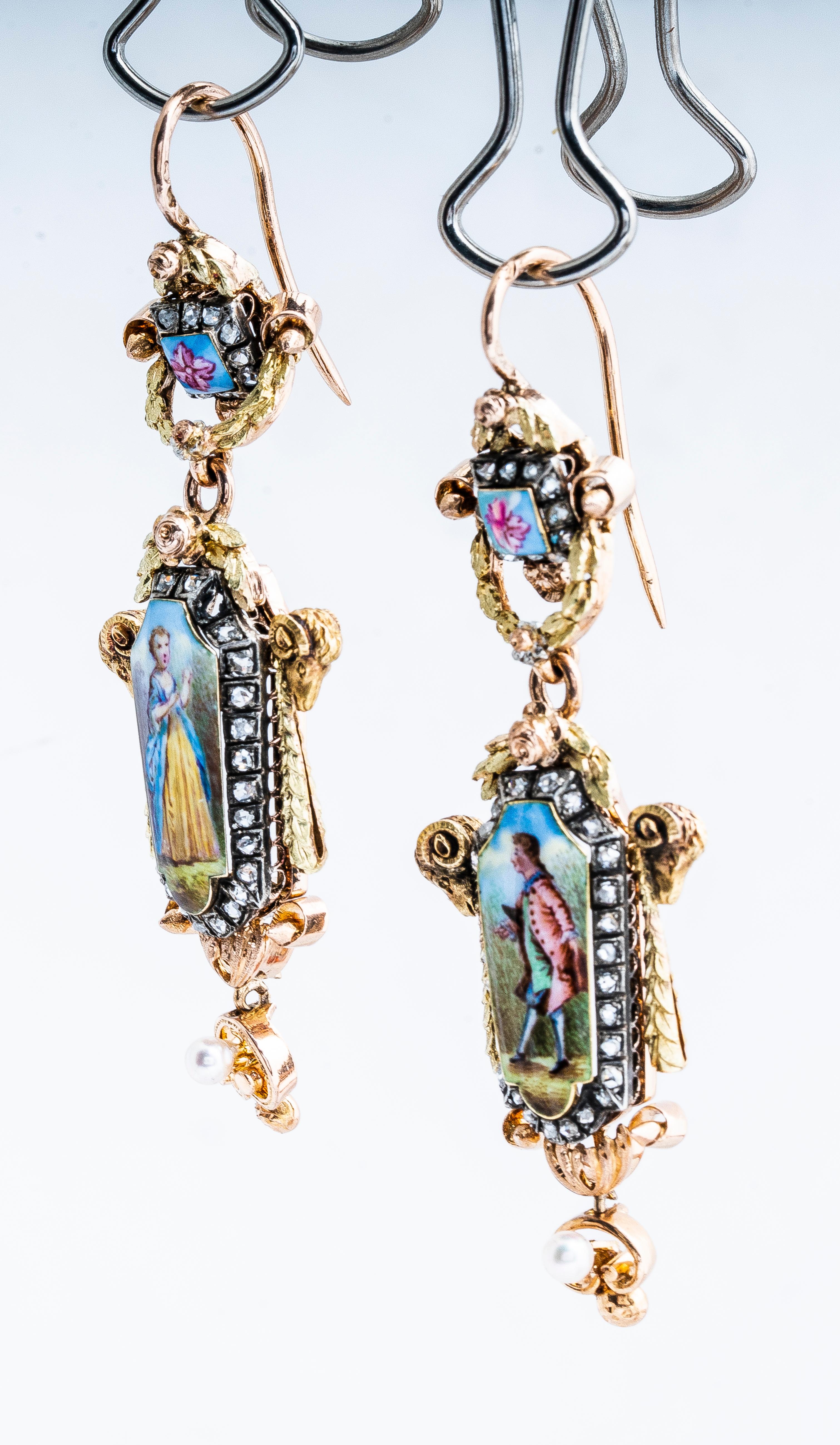 Antique Georgian 18k yellow and rose gold with silver top painted mini portrait man/woman portrait French dangle earrings with shepherd hooks.  Earrings have a man on one earrings and a woman on the other.  Rose cut diamonds encircle the portraits