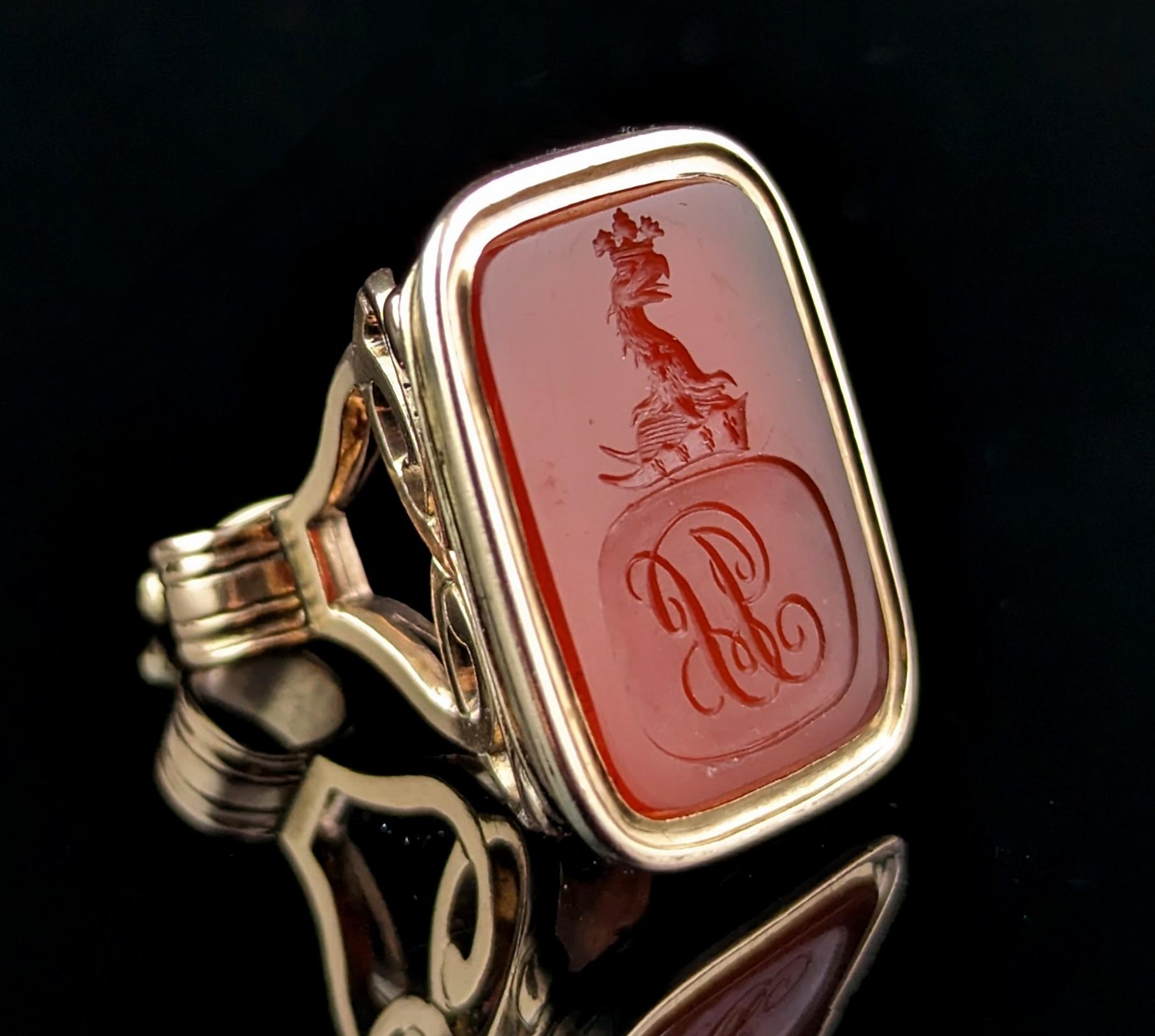 There is something extra special and quite simply mesmerising about antique Heraldic seal fobs.

This fine Georgian intaglio seal fob is crafted in 9ct gold with an openwork scrolling design to the top with an integral bale and a gold bezel