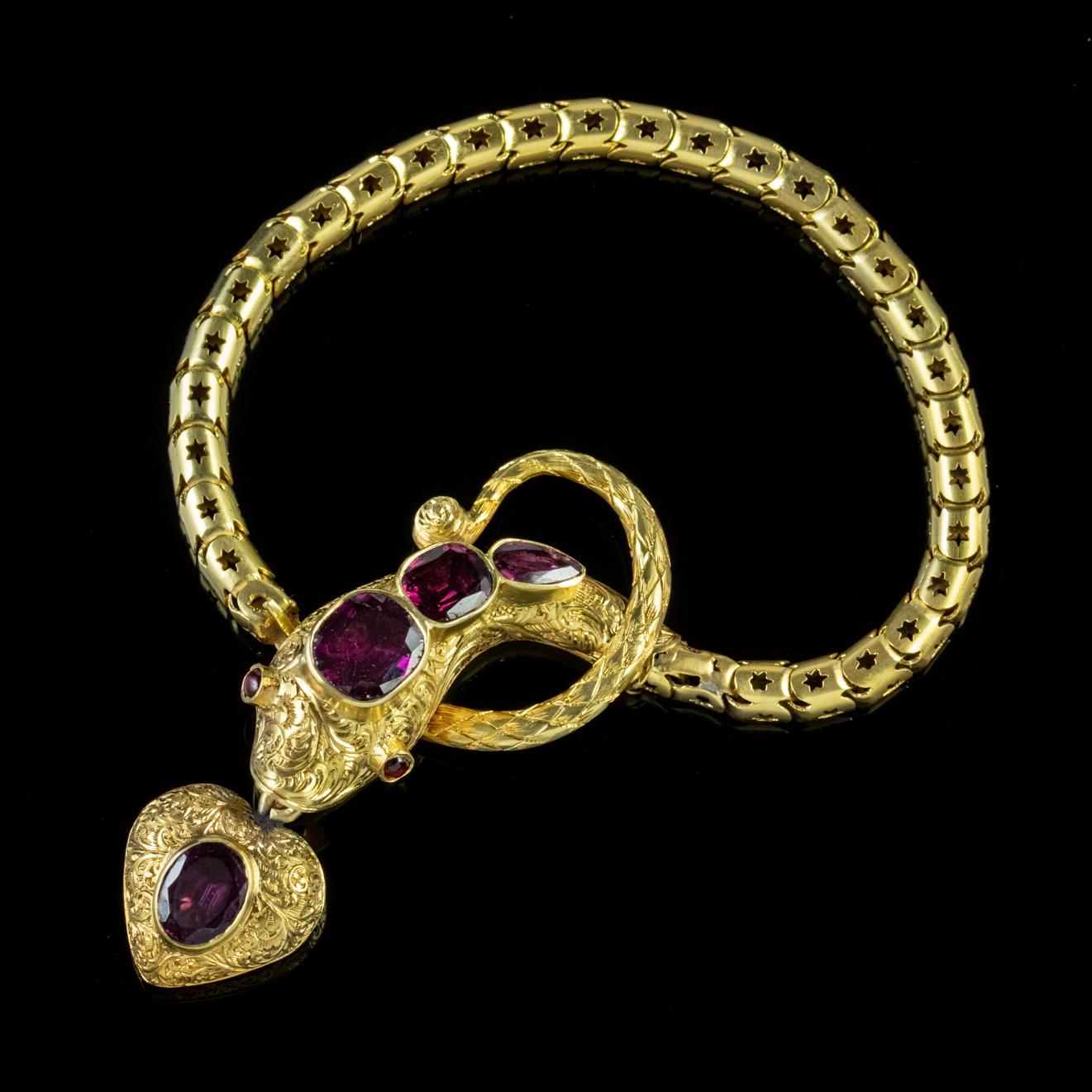 A wonderful solid 18ct Gold antique Georgian serpent bracelet showcasing over 5ct of beautiful deep Almandine Garnets of various shapes and sizes set upon the snake’s head and eyes.

Almandine Garnet’s are known as the stone of Truth and are beloved