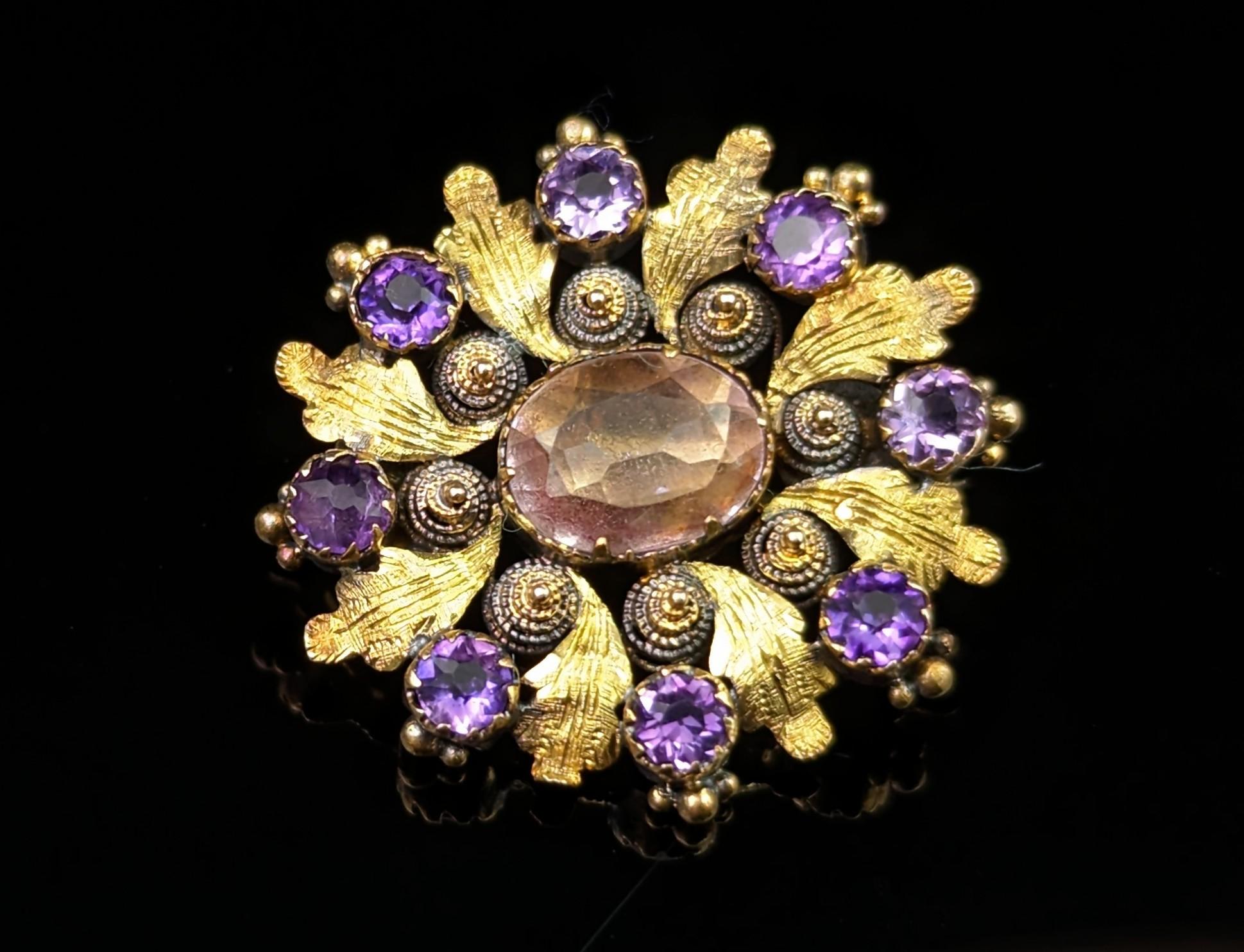 You cannot help but be charmed by this luxurious antique Georgian Amethyst and cannetille worn brooch.

There is something extra special about antique
cannetille pieces, the tiny details and the hours of work that went into creating such delicate
