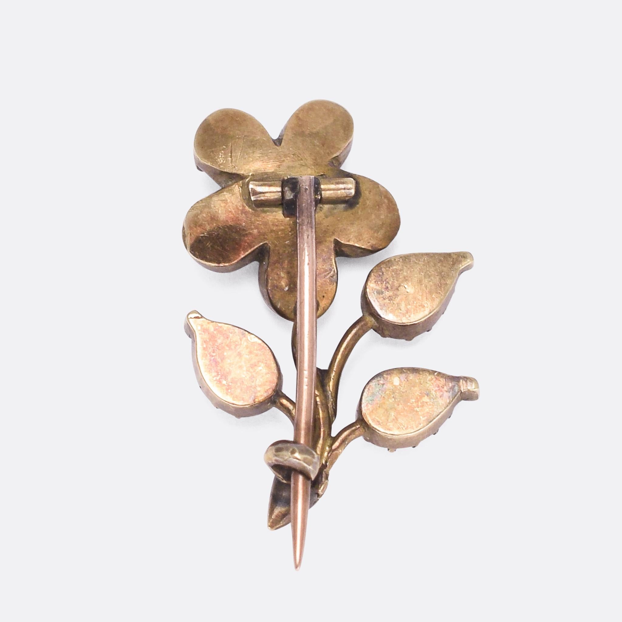 A pretty antique flower brooch dating from the early 19th Century. It's set with foil-backed amethyst stones, and crafted in the form of a Forget-Me-Not. 

STONES 
Amethyst

MEASUREMENTS 
2.2 x 1.6cm

WEIGHT 
2.1g

MARKS 
No marks present, tests as