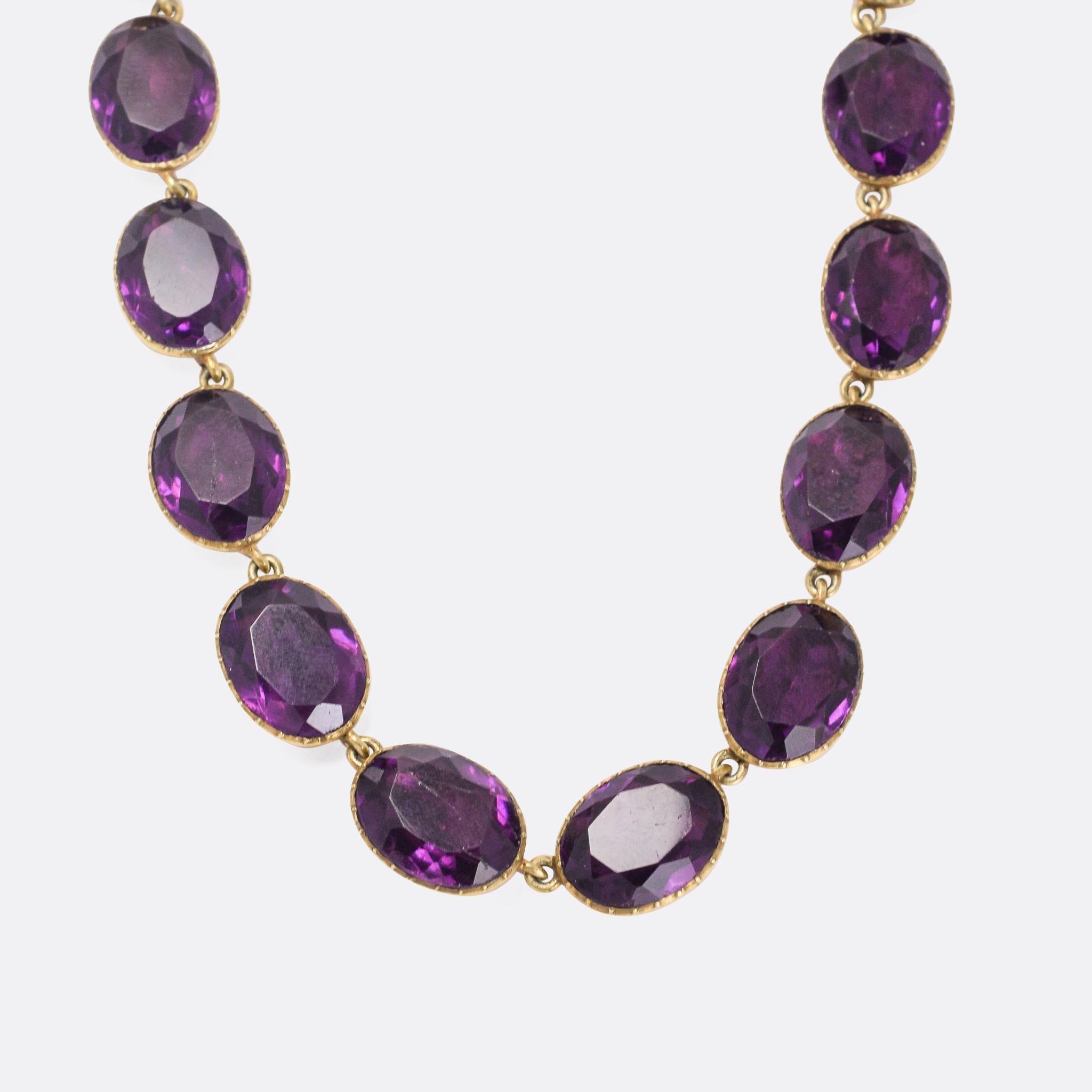 An impressive Georgian paste rivière necklace dating from the early 19th Century. It's set with 20 vibrant amethyst pastes, in pie-crust settings with foil behind to enhance their brightness. It's a very wearable length at 15 inches; and rare to