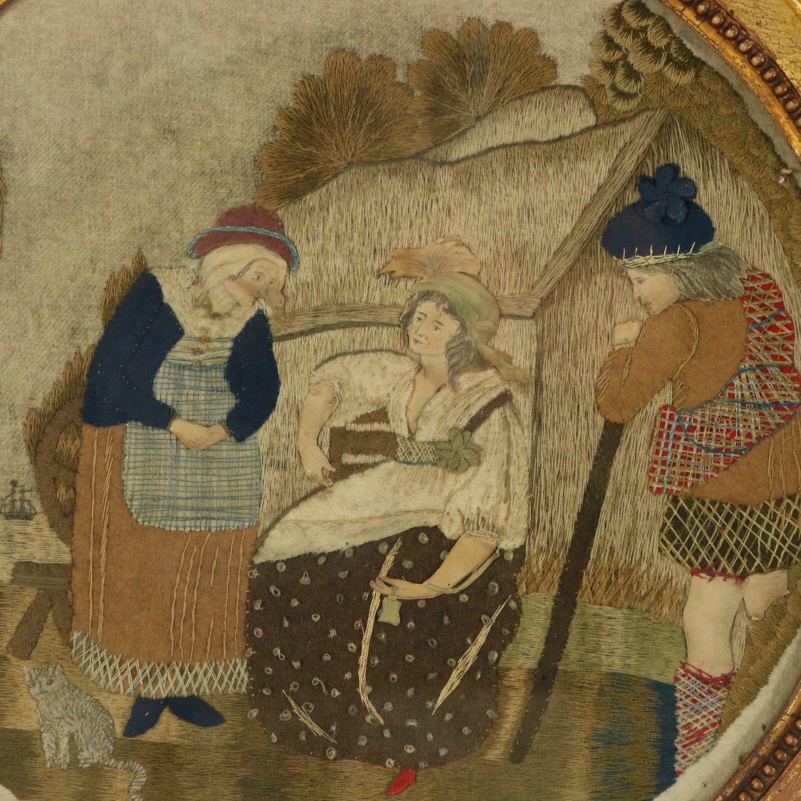 Broderie d'applique géorgienne ancienne représentant une scène champêtre. La broderie est réalisée avec une variété de fils et de matériaux, sur un fond de feutre. Les visages et les mains des personnages sont travaillés en papier. Cette scène