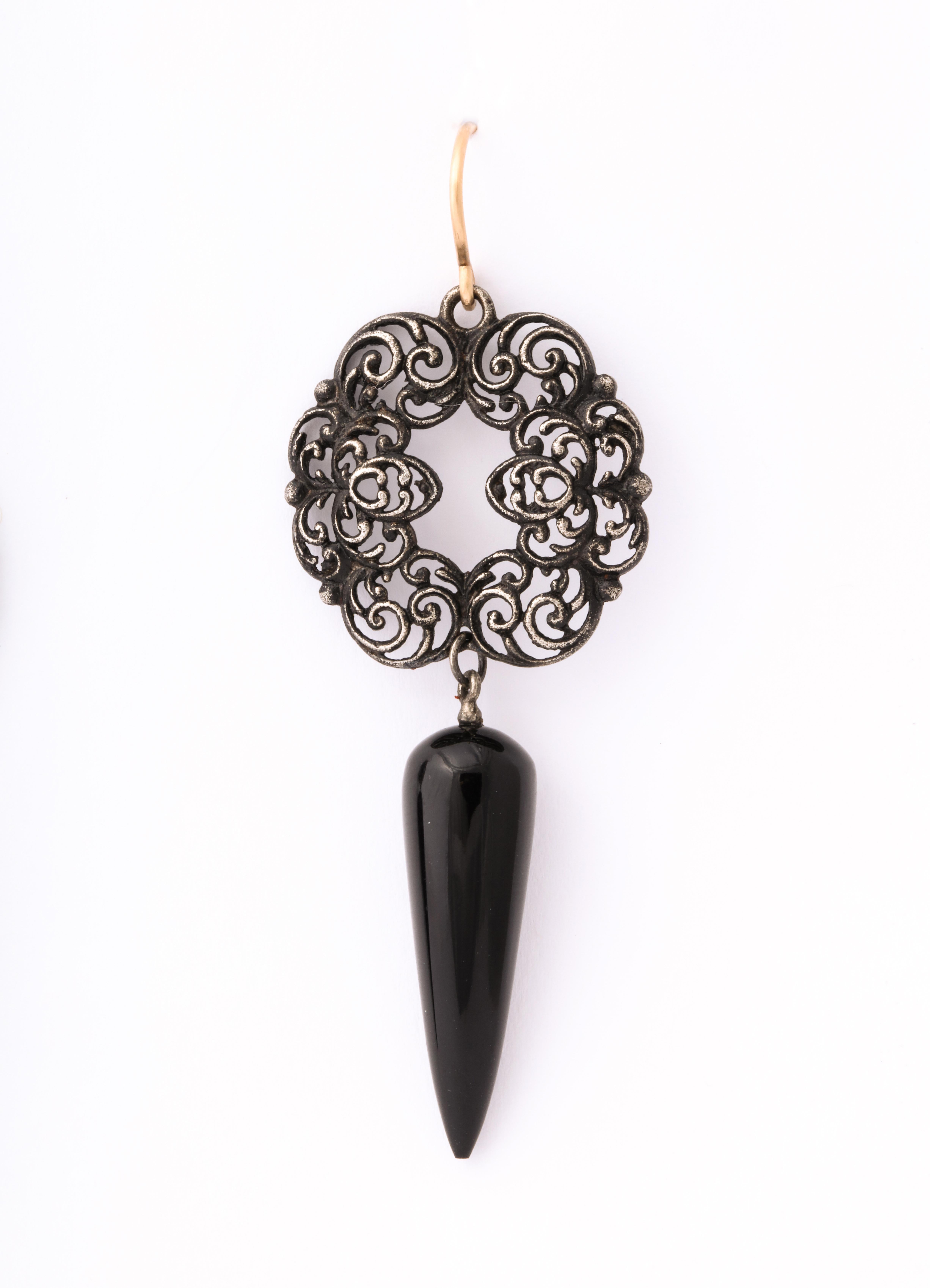 Geiss round, scrolling vines are the top section of these Berlin Iron earrings c. 1820. We added the onyx teardrops thereby creating a pair of romantic and very lovely chandelier earrings , light on the ear and uniquely beautiful. The earrings were