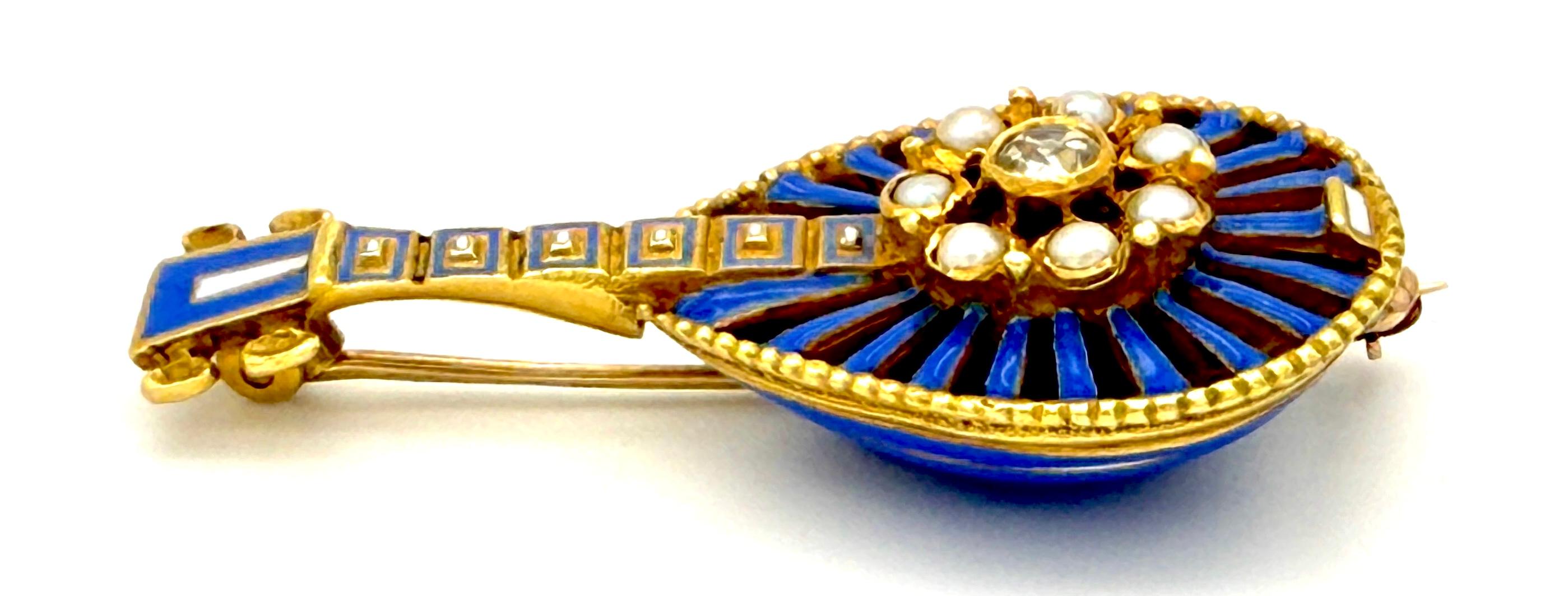 This exquisite brooch is designed in the shape of a miniature round-backed mandolin. It was created around 1825 out of 18K gold. The body, the neck and the headstock of the mandolin are embellished with intensive enamel colours, pale blue and a